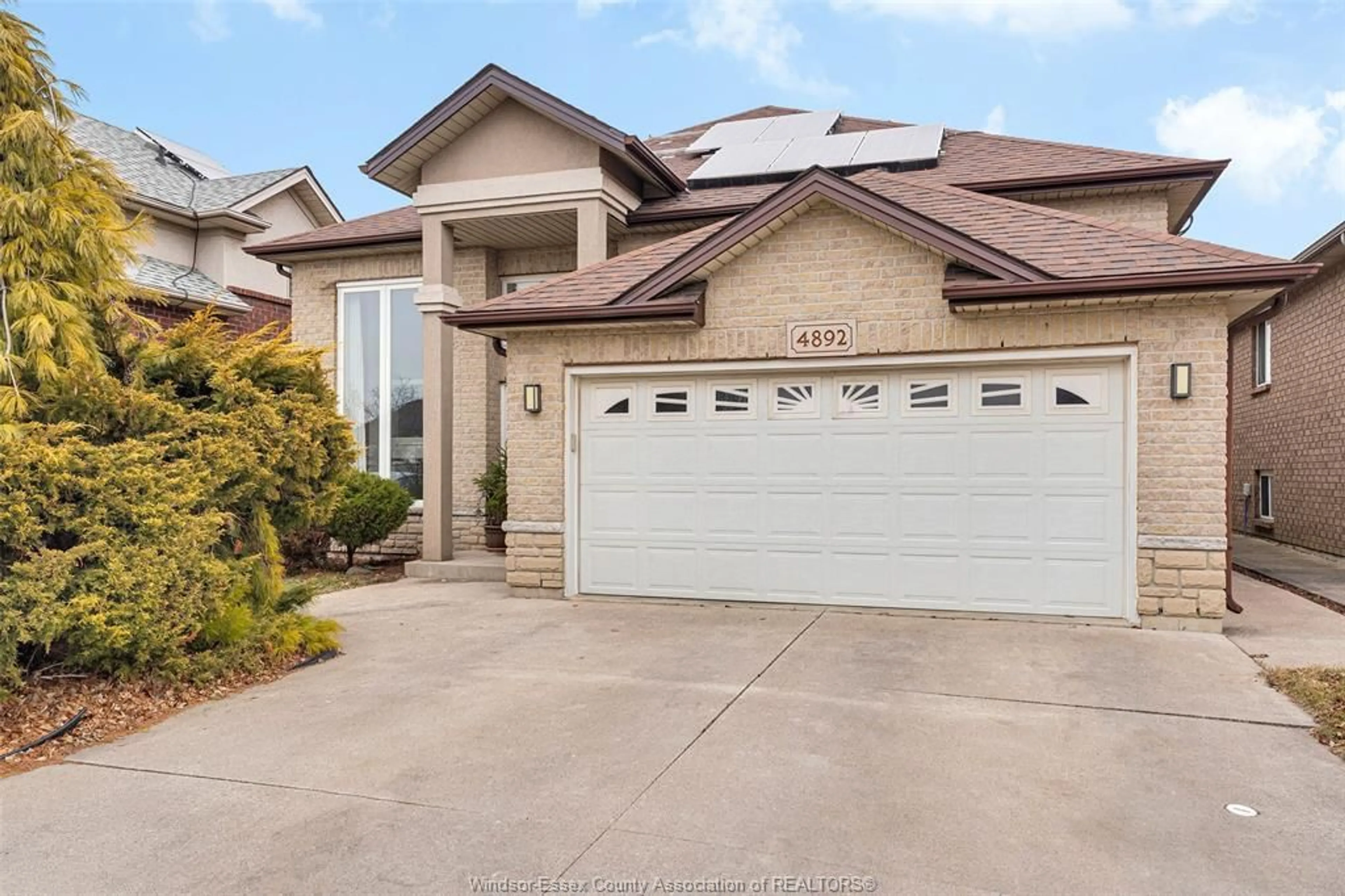 Home with brick exterior material, street for 4892 Barcelona Cres, Windsor Ontario N9G 3G1