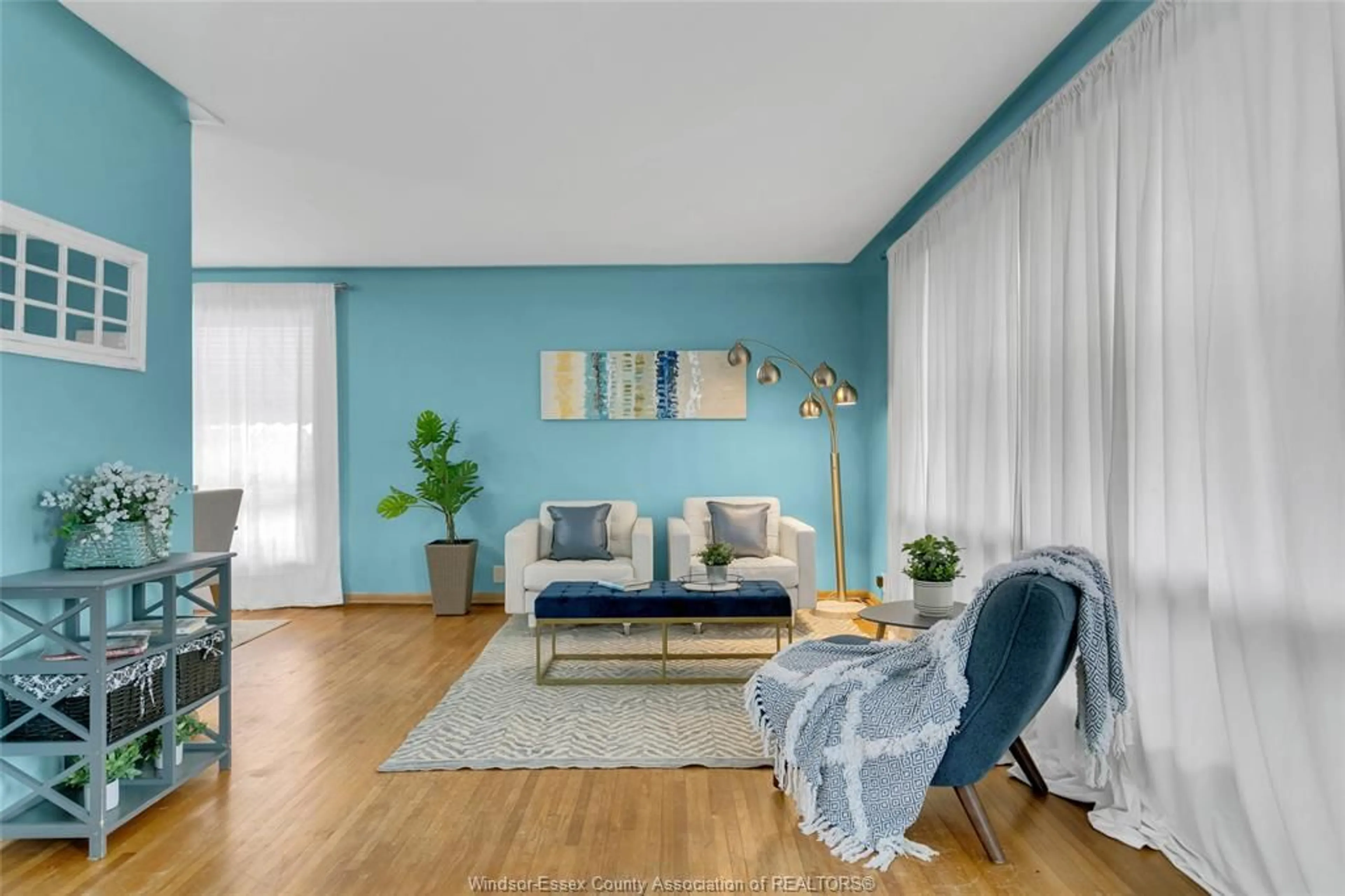 Living room with furniture, wood/laminate floor for 3425 RANKIN, Windsor Ontario N9E 3C4