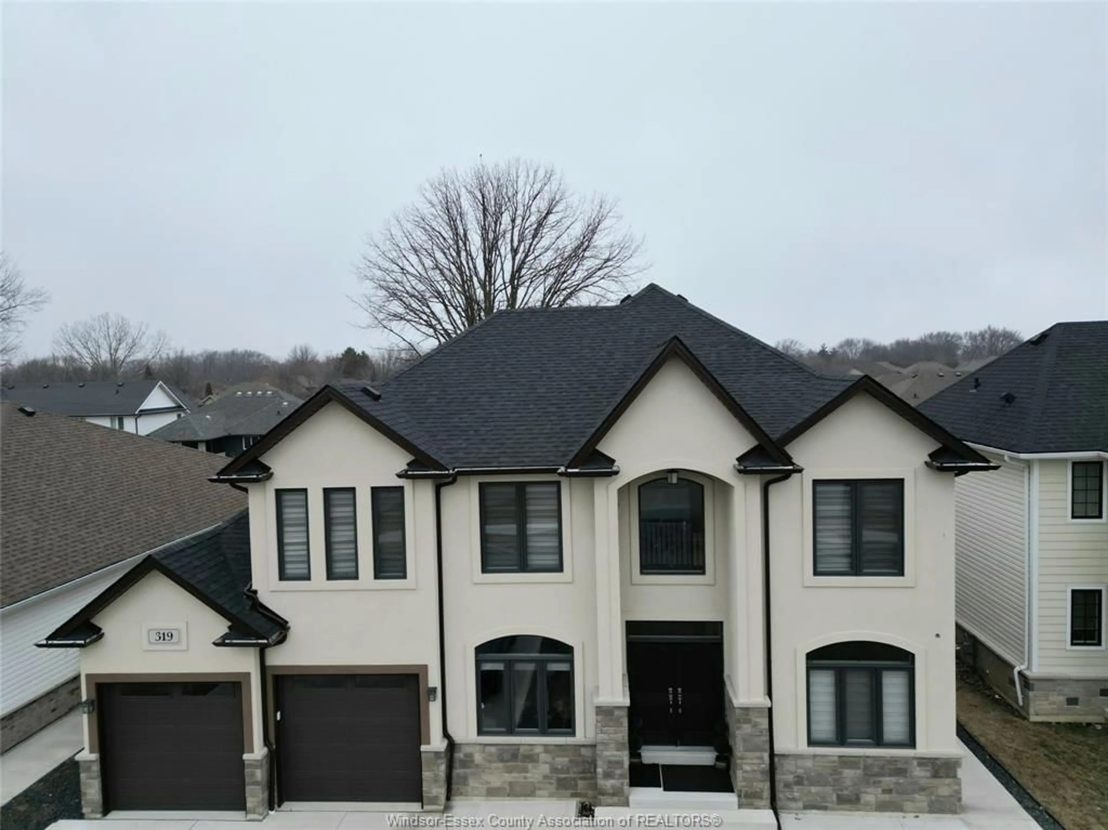 Home with brick exterior material, street for 319 CHRISTINE Ave, Belle River Ontario N8L 1B5