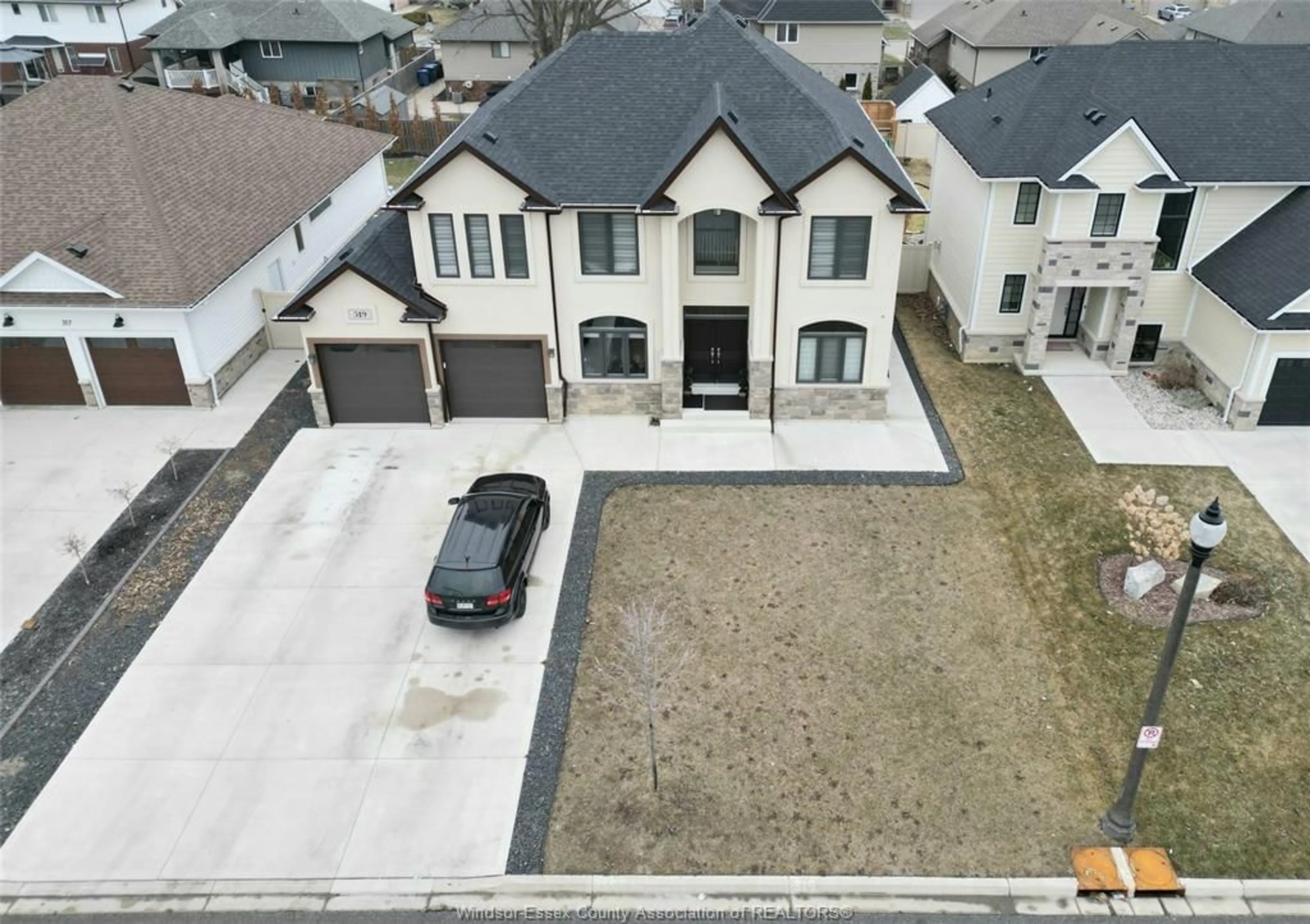 A pic from outside/outdoor area/front of a property/back of a property/a pic from drone, street for 319 CHRISTINE Ave, Belle River Ontario N8L 1B5