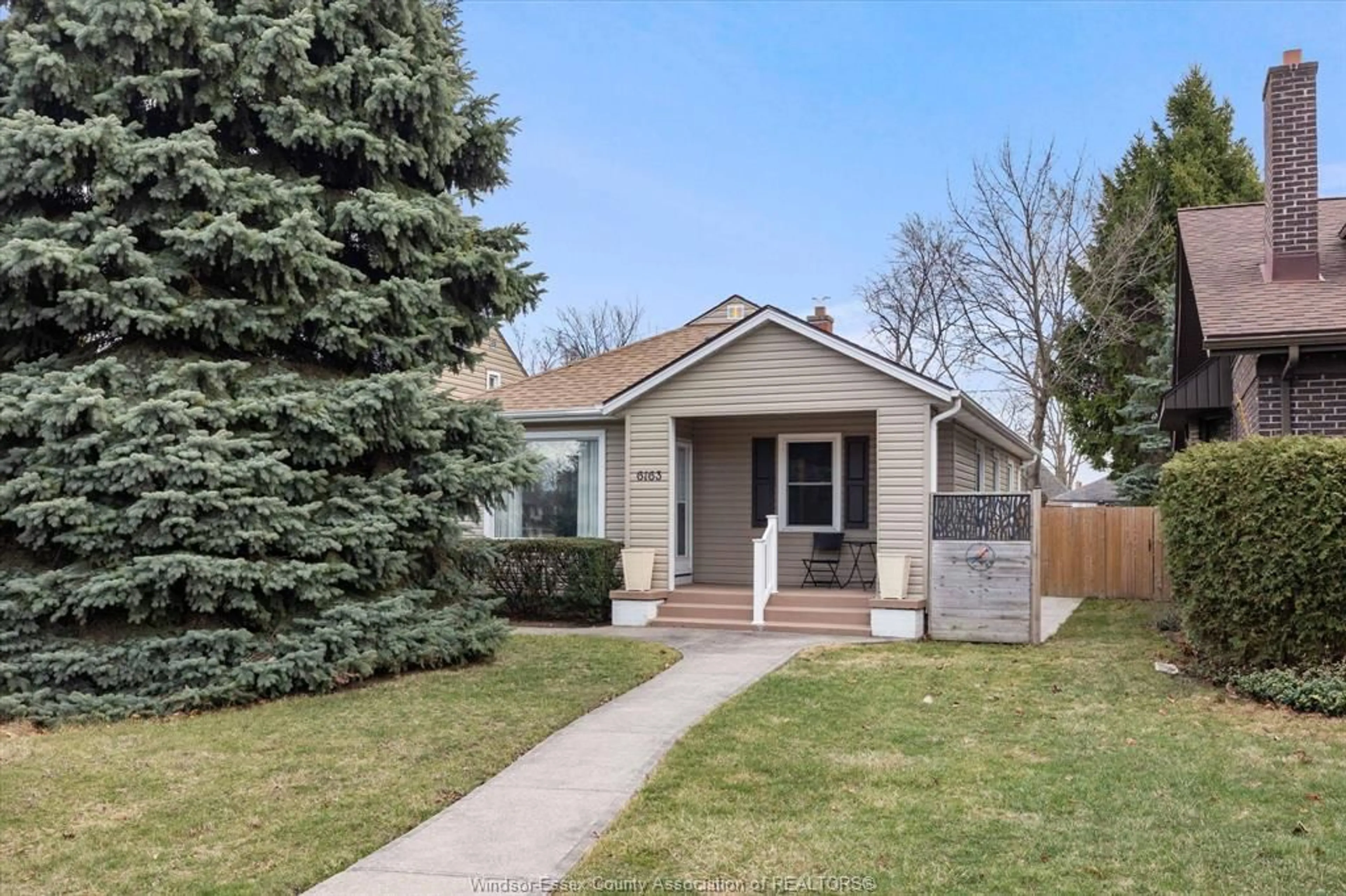 Home with vinyl exterior material, street for 6163 WYANDOTTE St, Windsor Ontario N8S 1N4