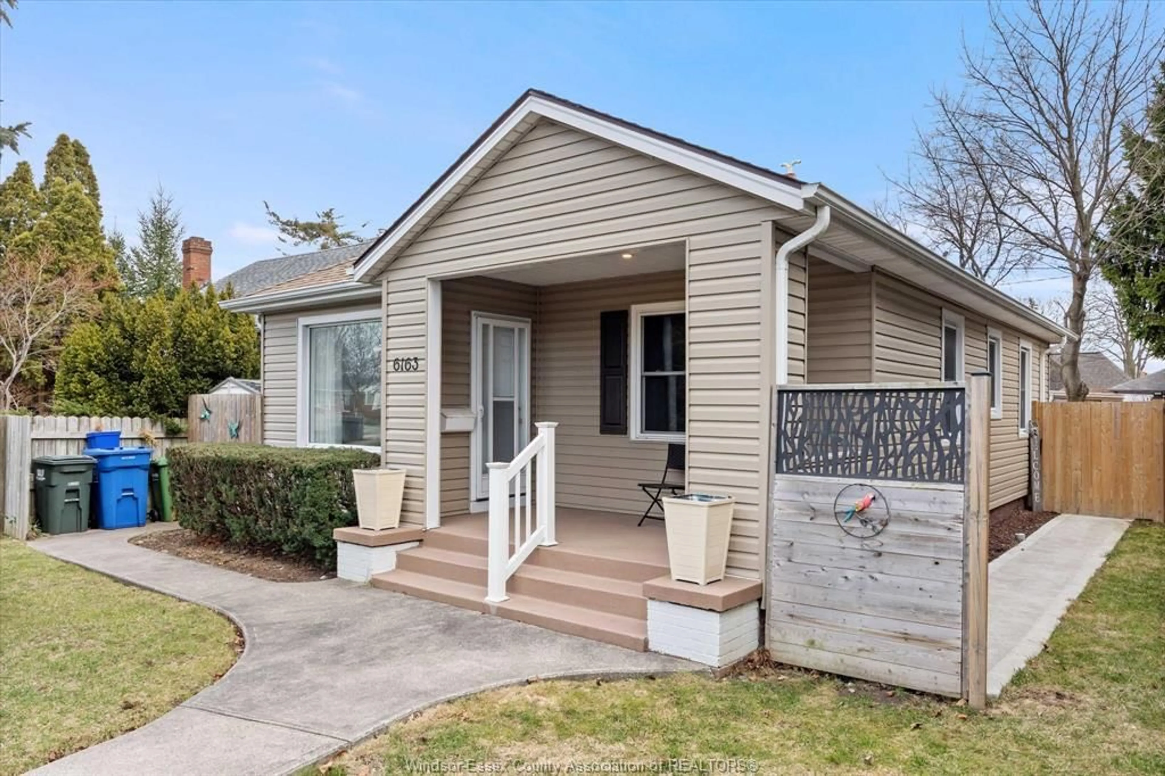 Home with vinyl exterior material, street for 6163 WYANDOTTE St, Windsor Ontario N8S 1N4