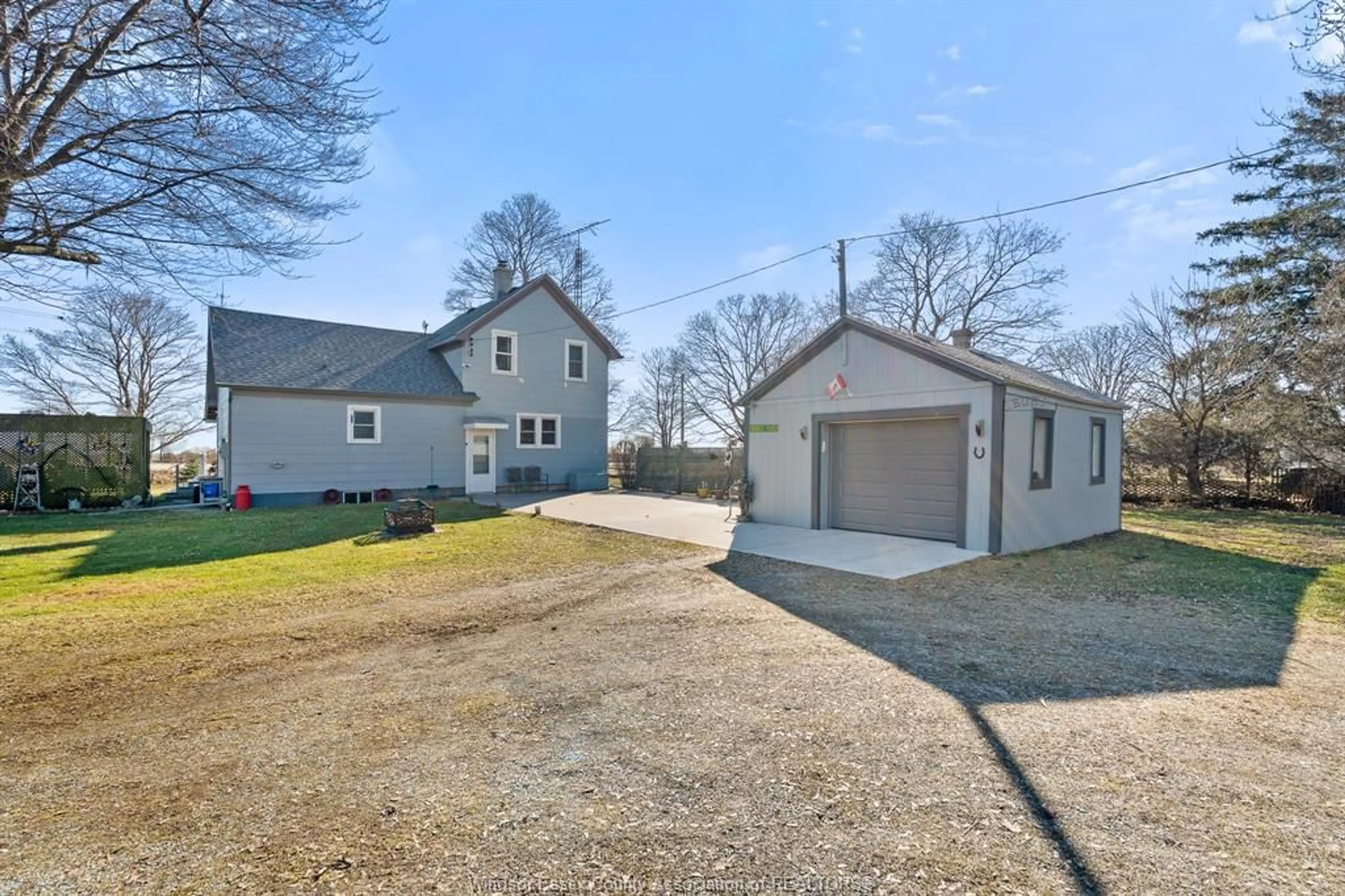 A pic from outside/outdoor area/front of a property/back of a property/a pic from drone, street for 2102 County Rd #20, Essex Ontario N0R 1G0