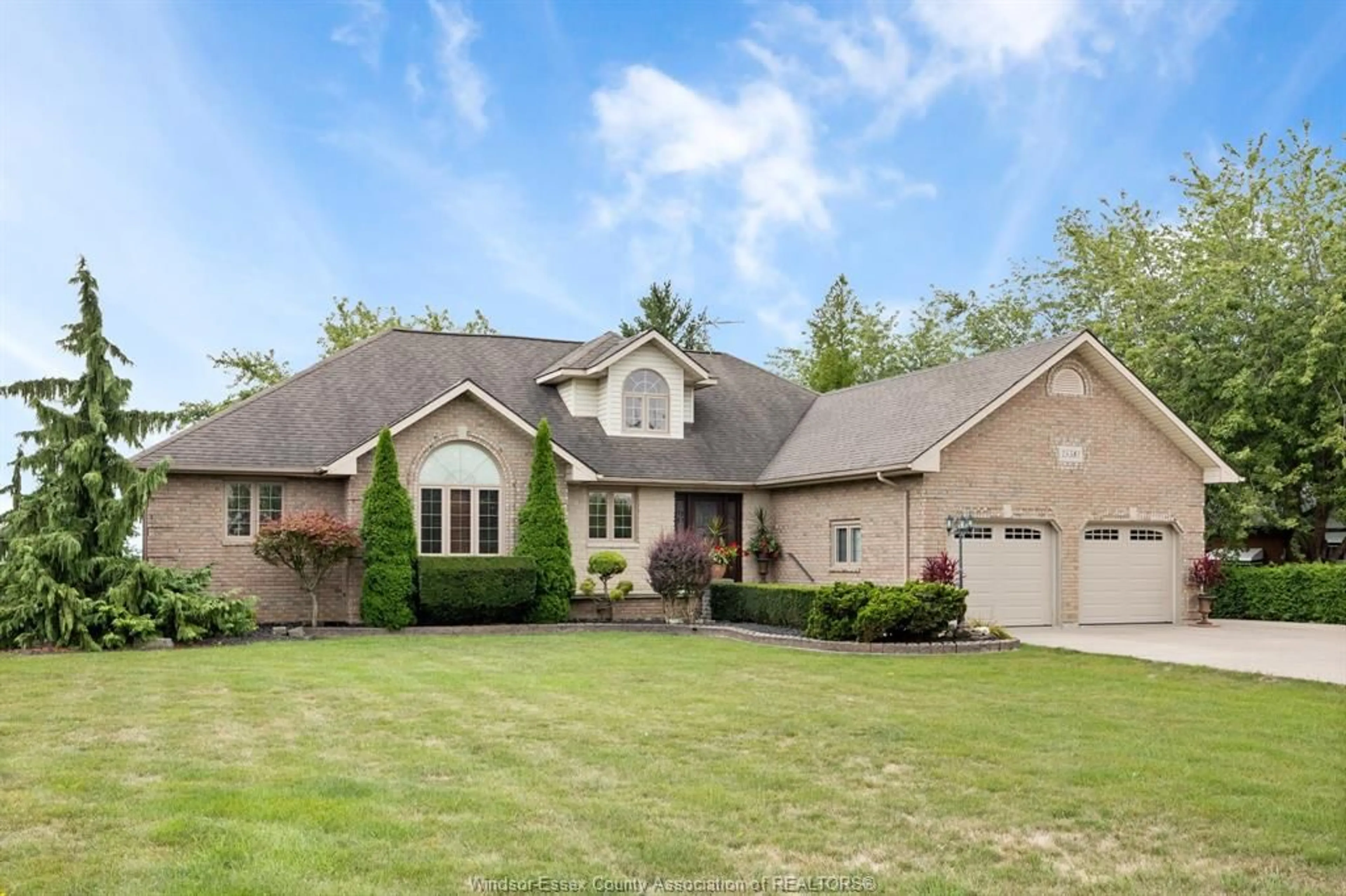 Home with vinyl exterior material, street for 15381 COUNTY RD 8, Essex Ontario N0R 1L0