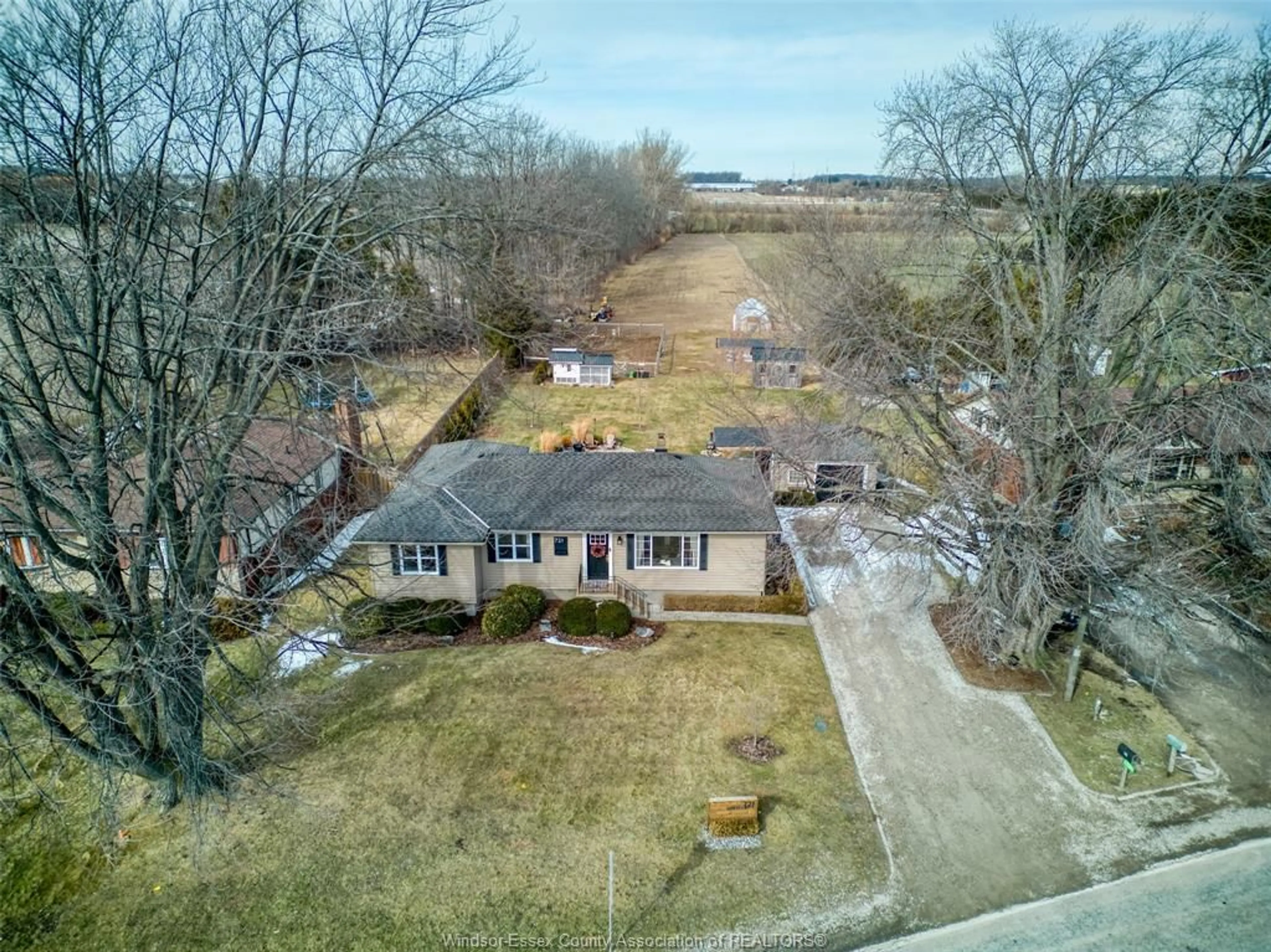 A pic from outside/outdoor area/front of a property/back of a property/a pic from drone, street for 721 MERSEA RD 4, Leamington Ontario N8H 3V6