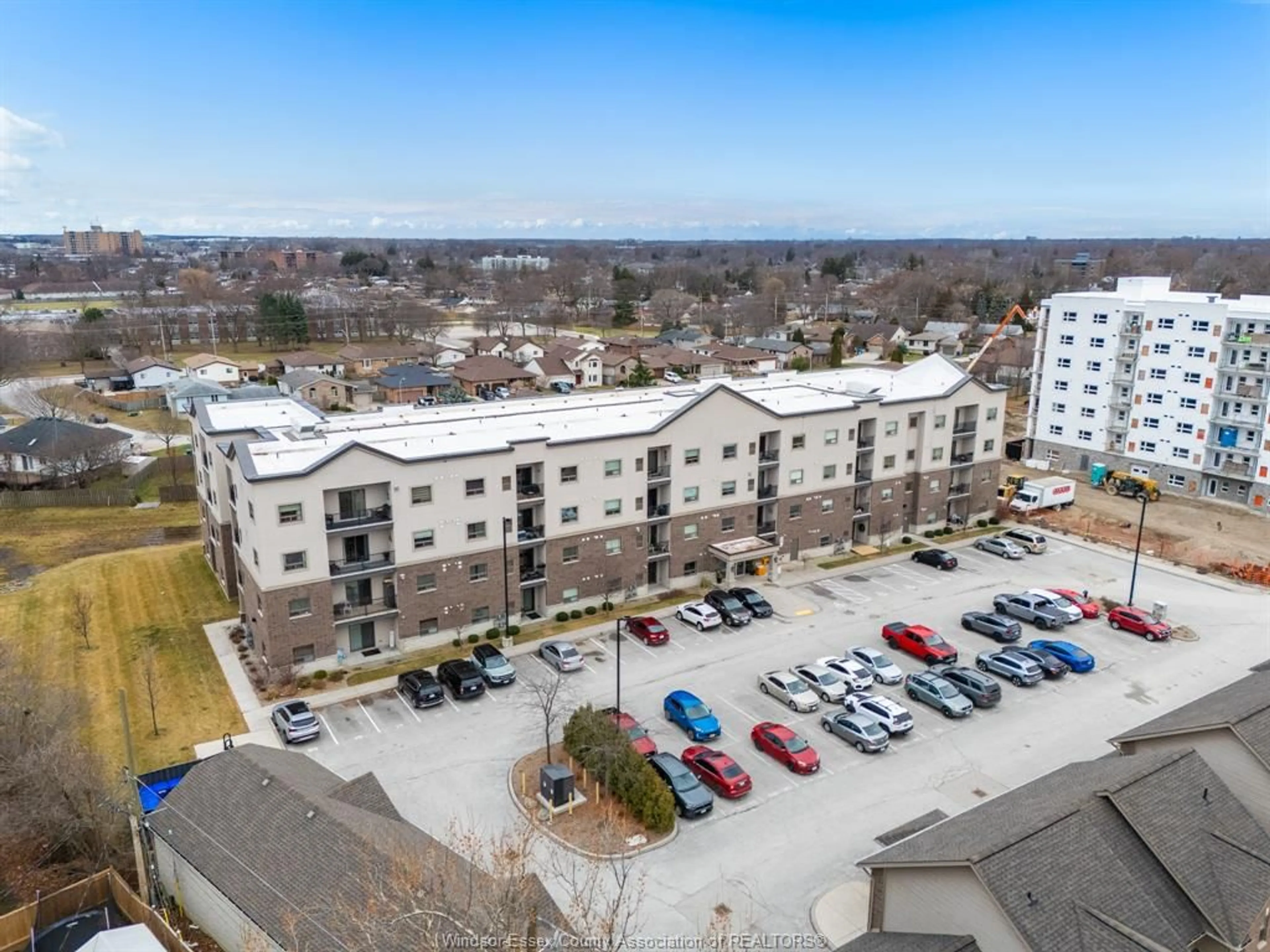 A pic from outside/outdoor area/front of a property/back of a property/a pic from drone, unknown for 8475 Wyandotte St #111, Windsor Ontario N8S 0A4