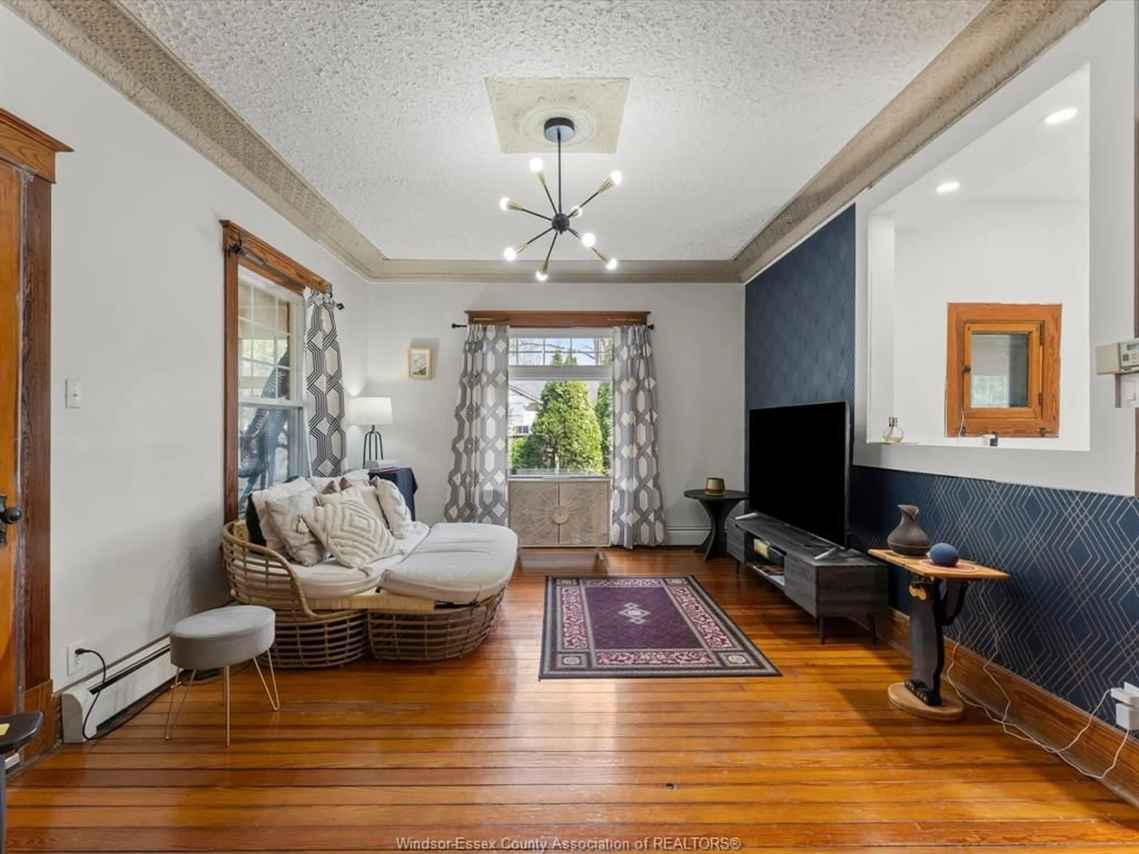 Living room with furniture, wood/laminate floor for 24397 JEANNETTES CREEK Rd, Tilbury Ontario N0P 2L0