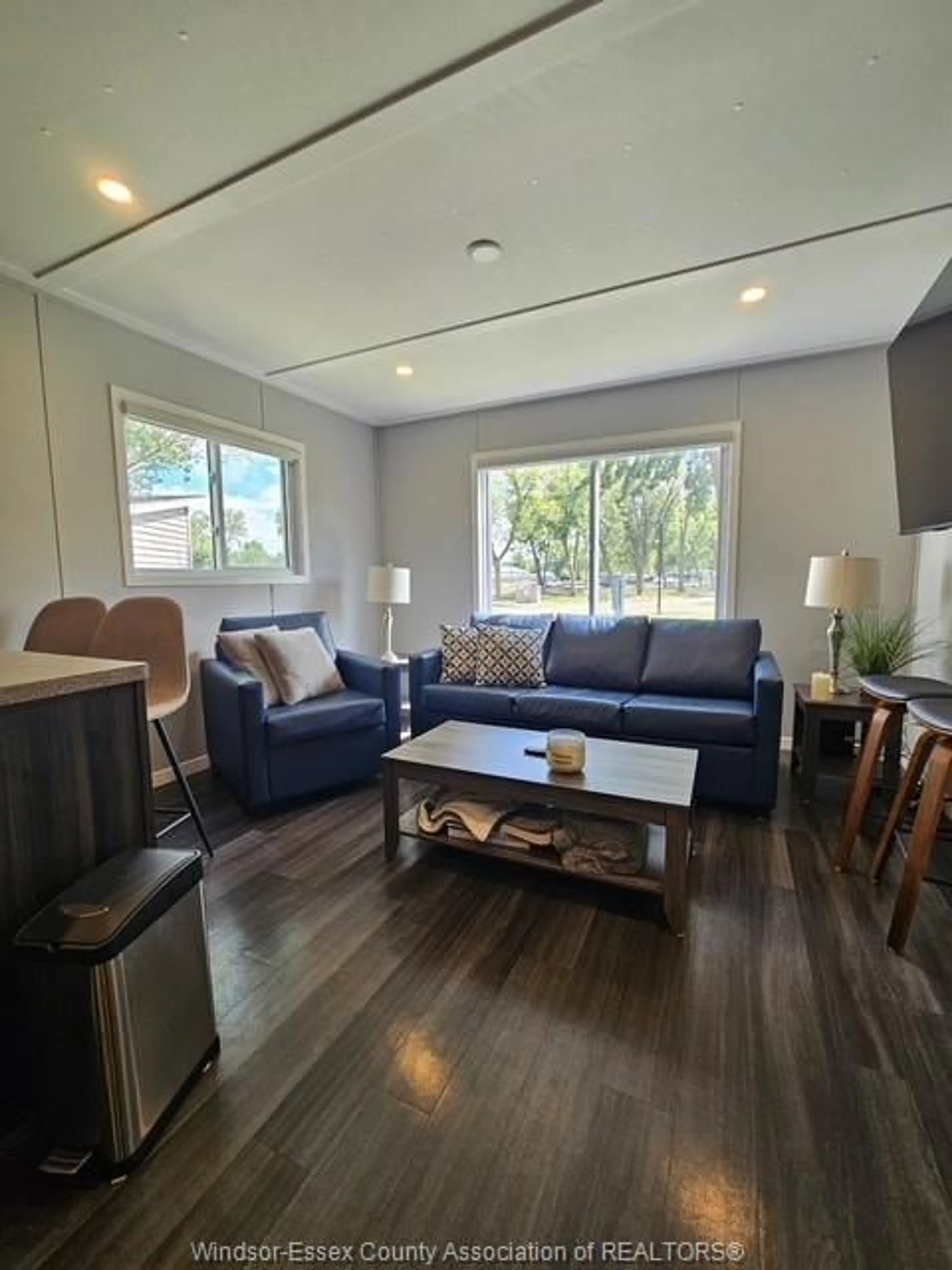 Living room with furniture, wood/laminate floor for 981 COUNTY RD 2 #439, Lakeshore Ontario N0R 1A0