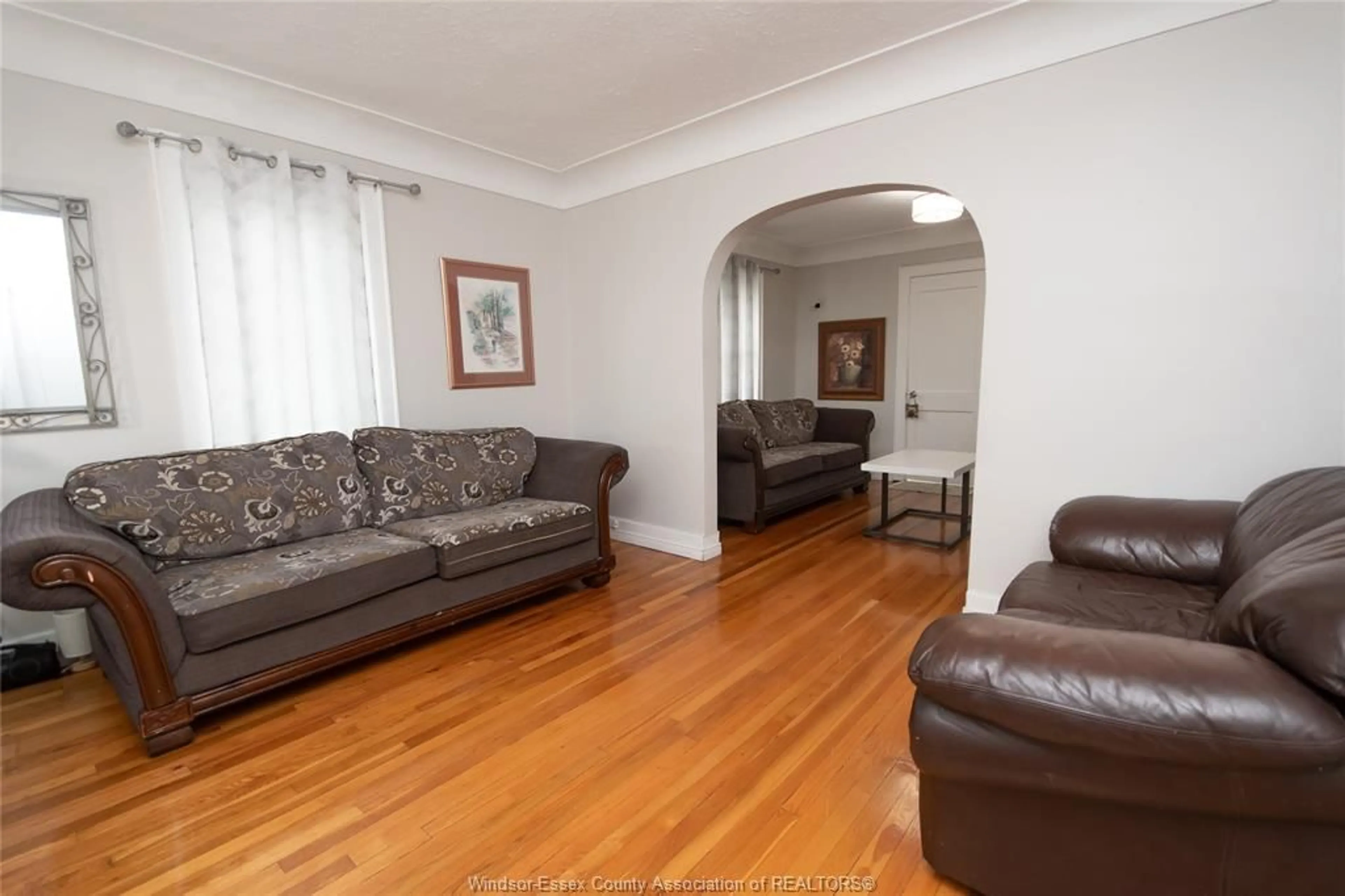 Living room with furniture, wood/laminate floor for 2236 CHURCH St, Windsor Ontario N8X 1V9