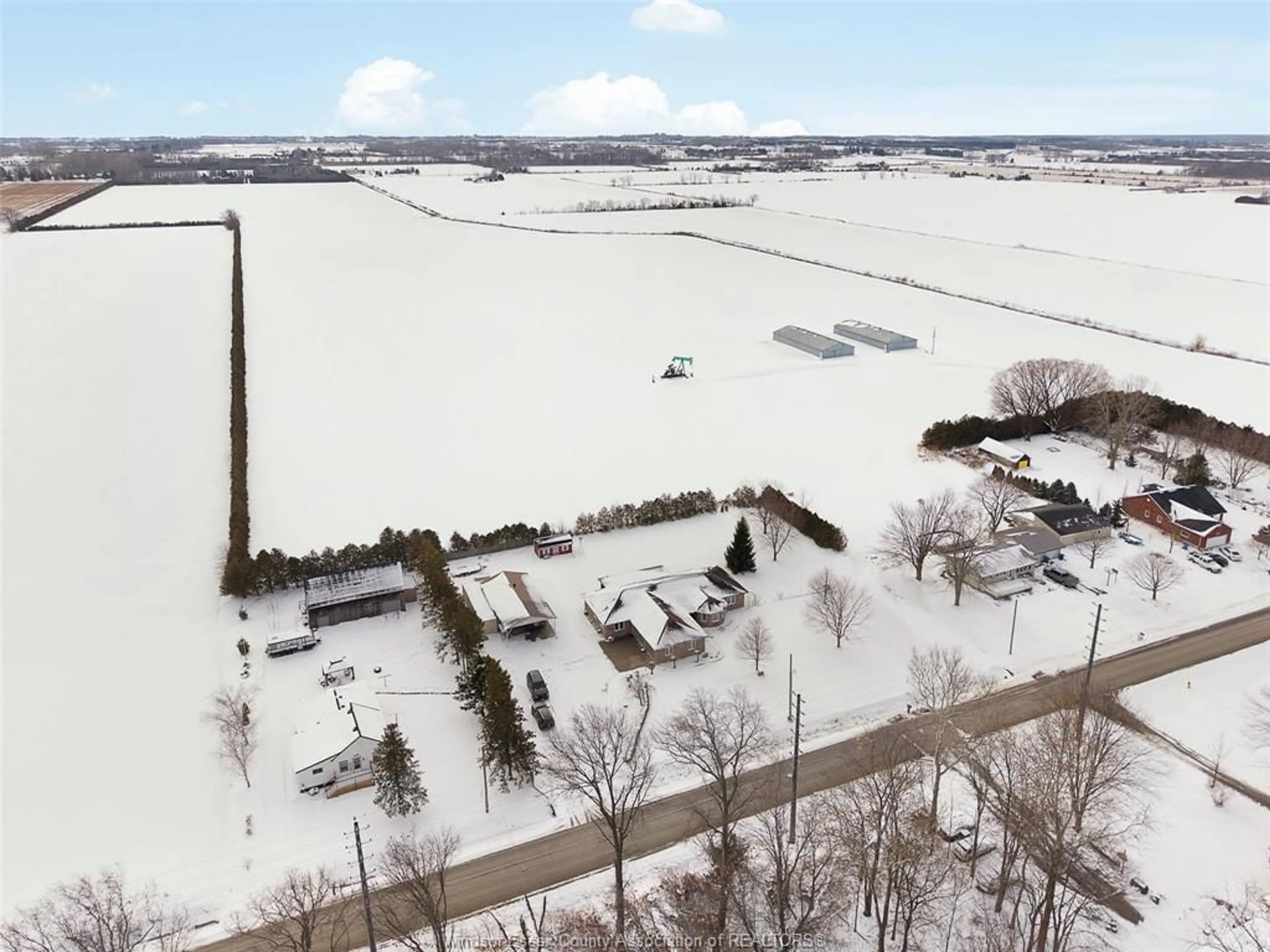 A pic from outside/outdoor area/front of a property/back of a property/a pic from drone, unknown for 224 MERSEA RD 7, Leamington Ontario N8H 3V8