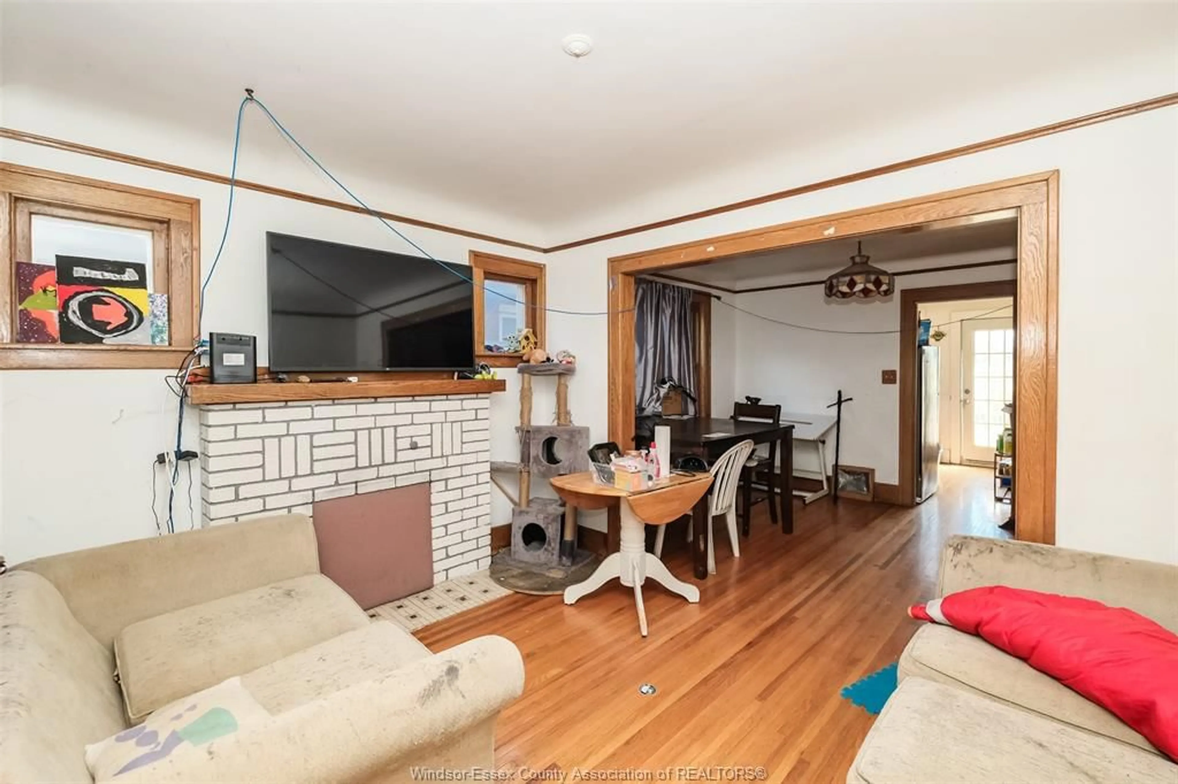 Living room with furniture, wood/laminate floor for 1248 BRUCE Ave, Windsor Ontario N8X 1X3