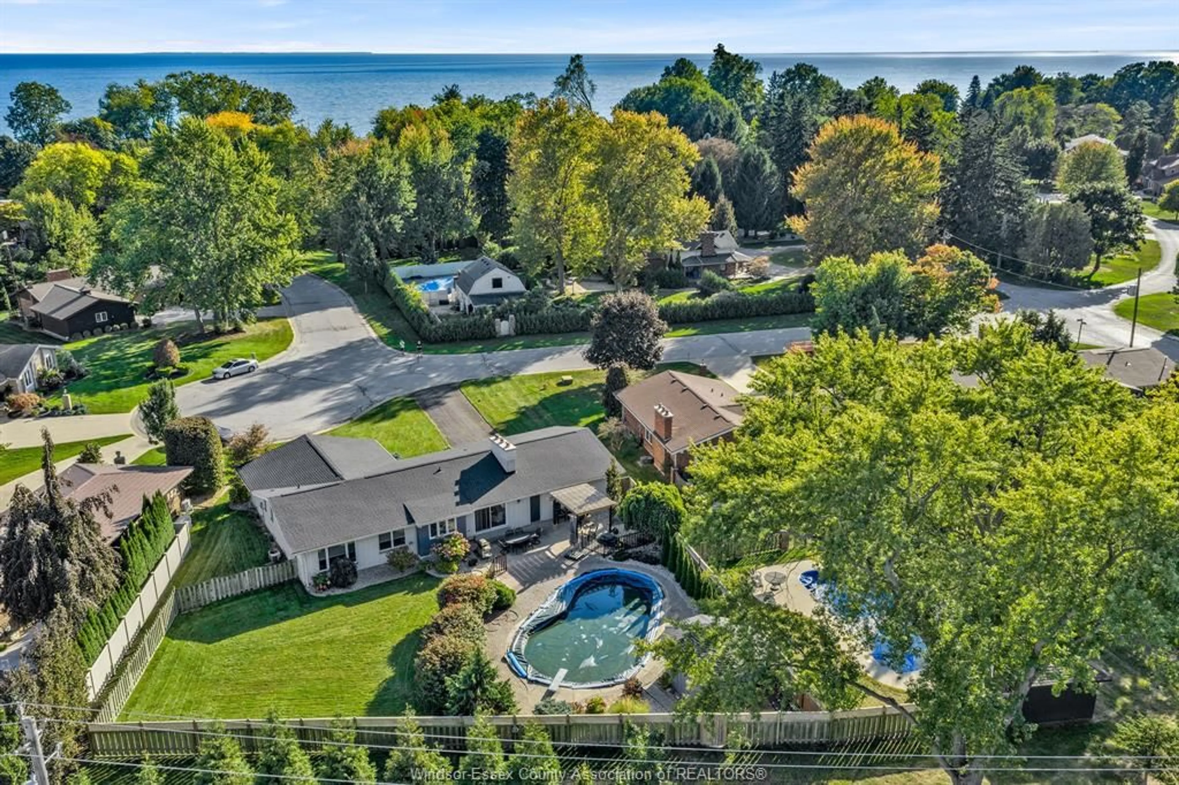 A pic from outside/outdoor area/front of a property/back of a property/a pic from drone, water/lake/river/ocean view for 7 LONGBEACH Dr, Leamington Ontario N8H 4H9