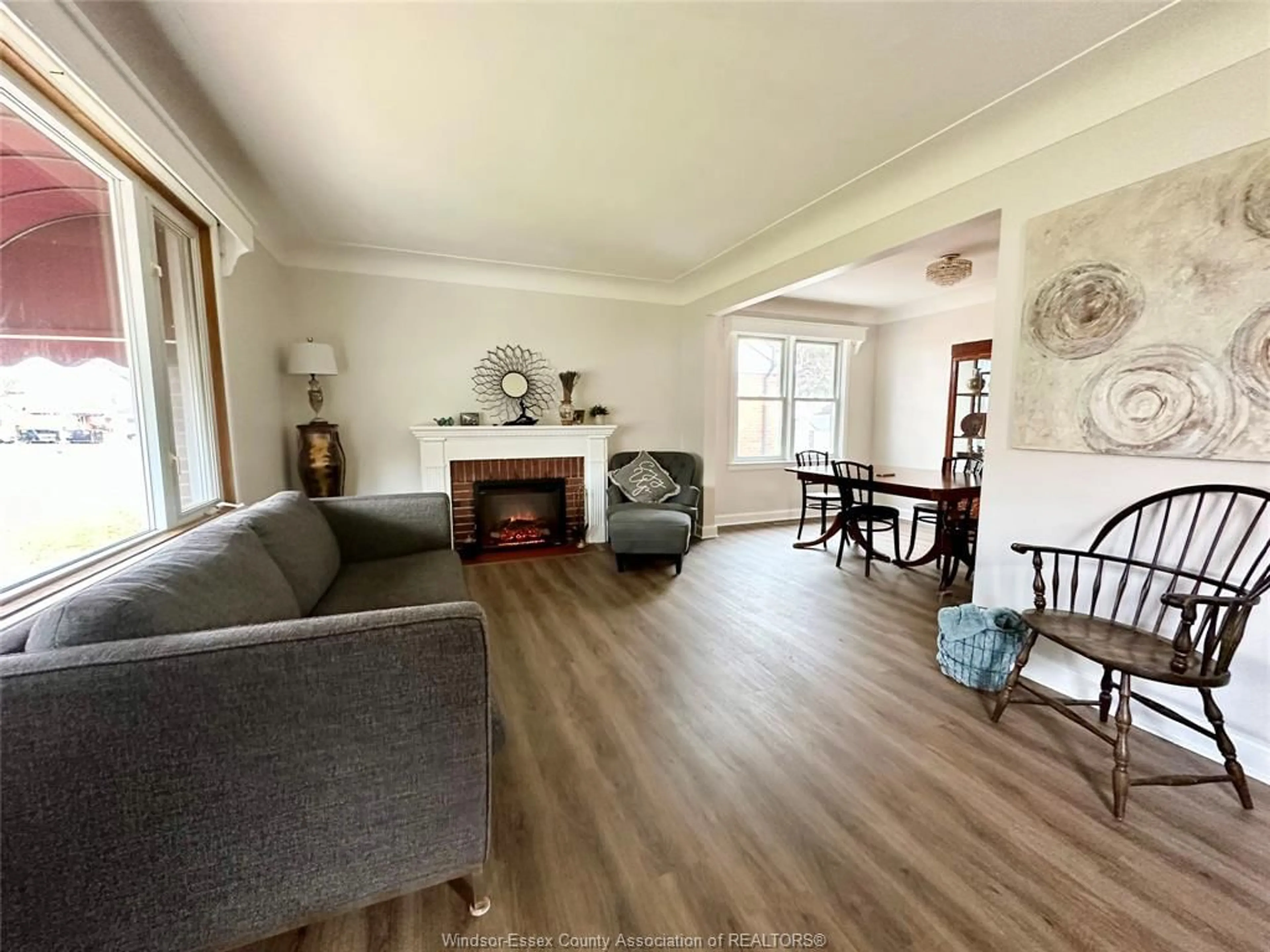 Living room with furniture, wood/laminate floor for 854 BELLEPERCHE Pl, Windsor Ontario N8S 3C1