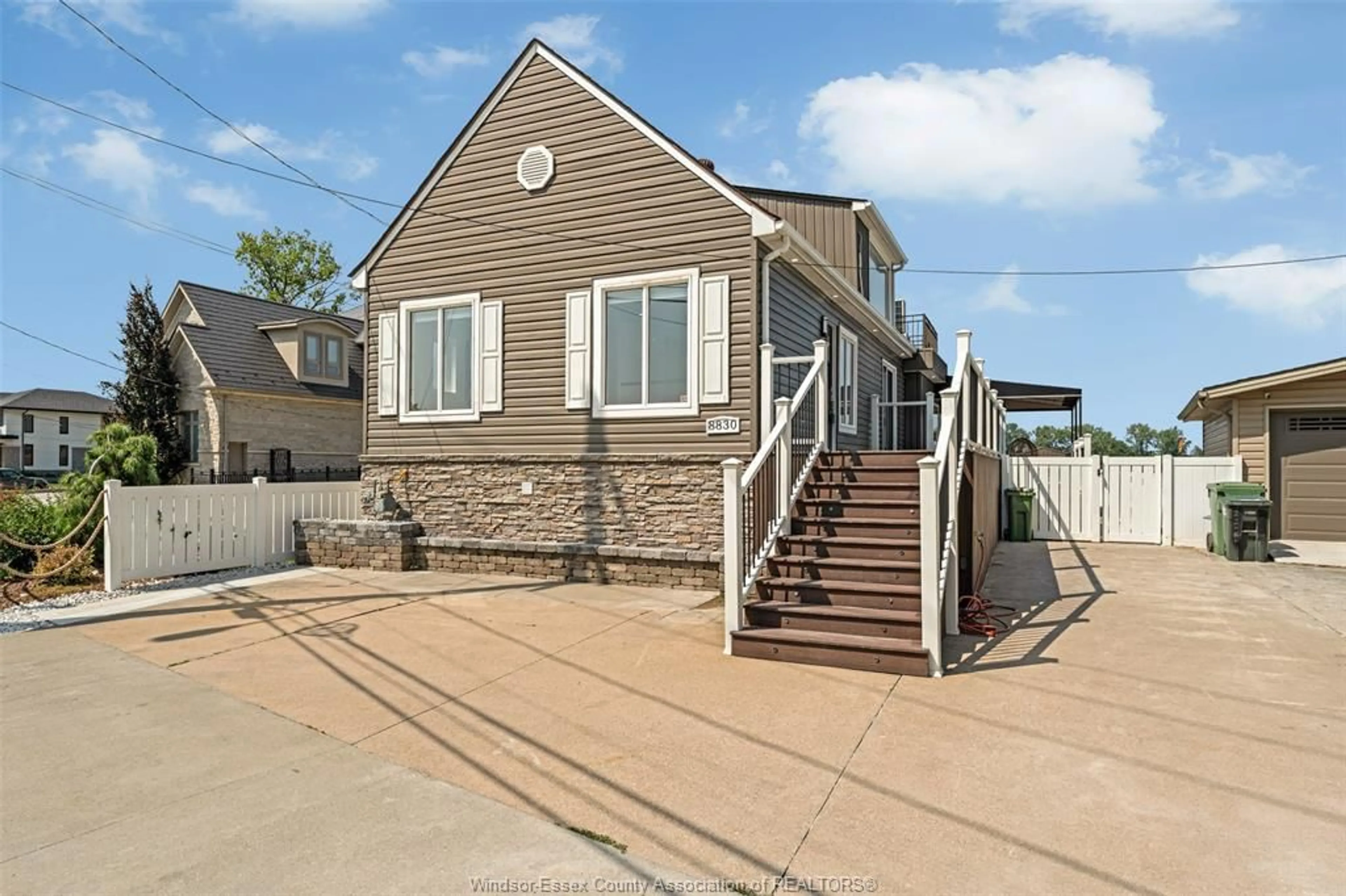 Home with vinyl exterior material, street for 8830 RIVERSIDE Dr, Windsor Ontario N8S 1G7