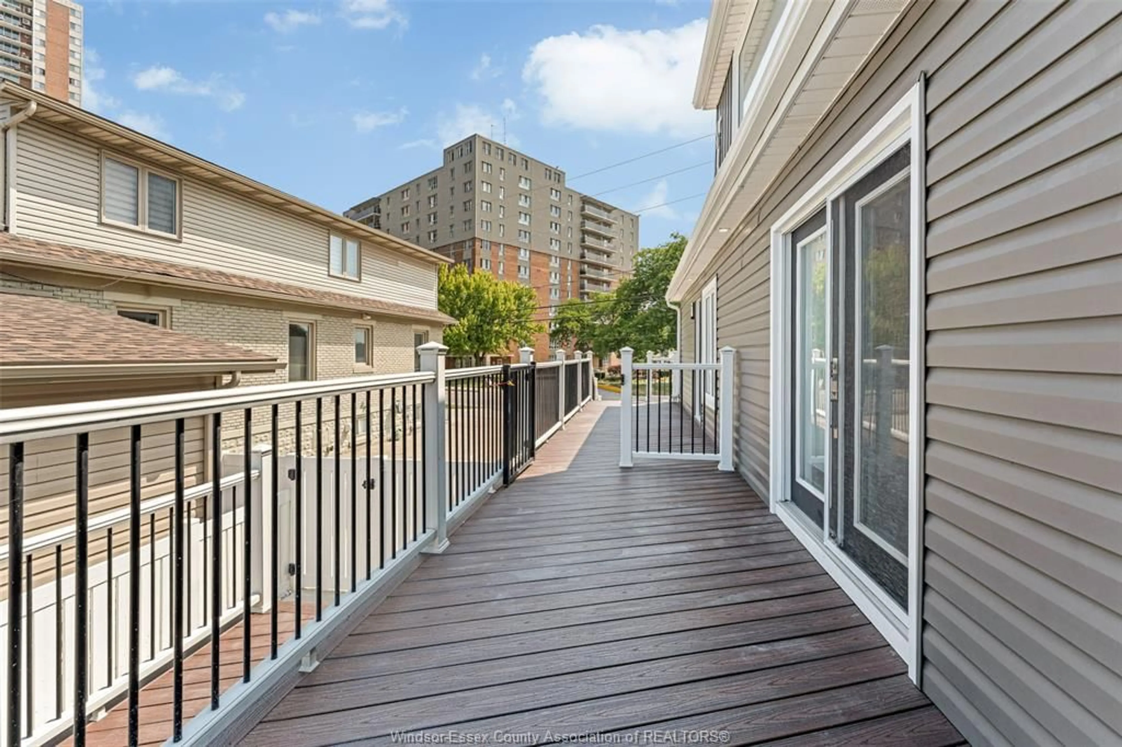 Patio, city buildings view from balcony for 8830 RIVERSIDE Dr, Windsor Ontario N8S 1G7