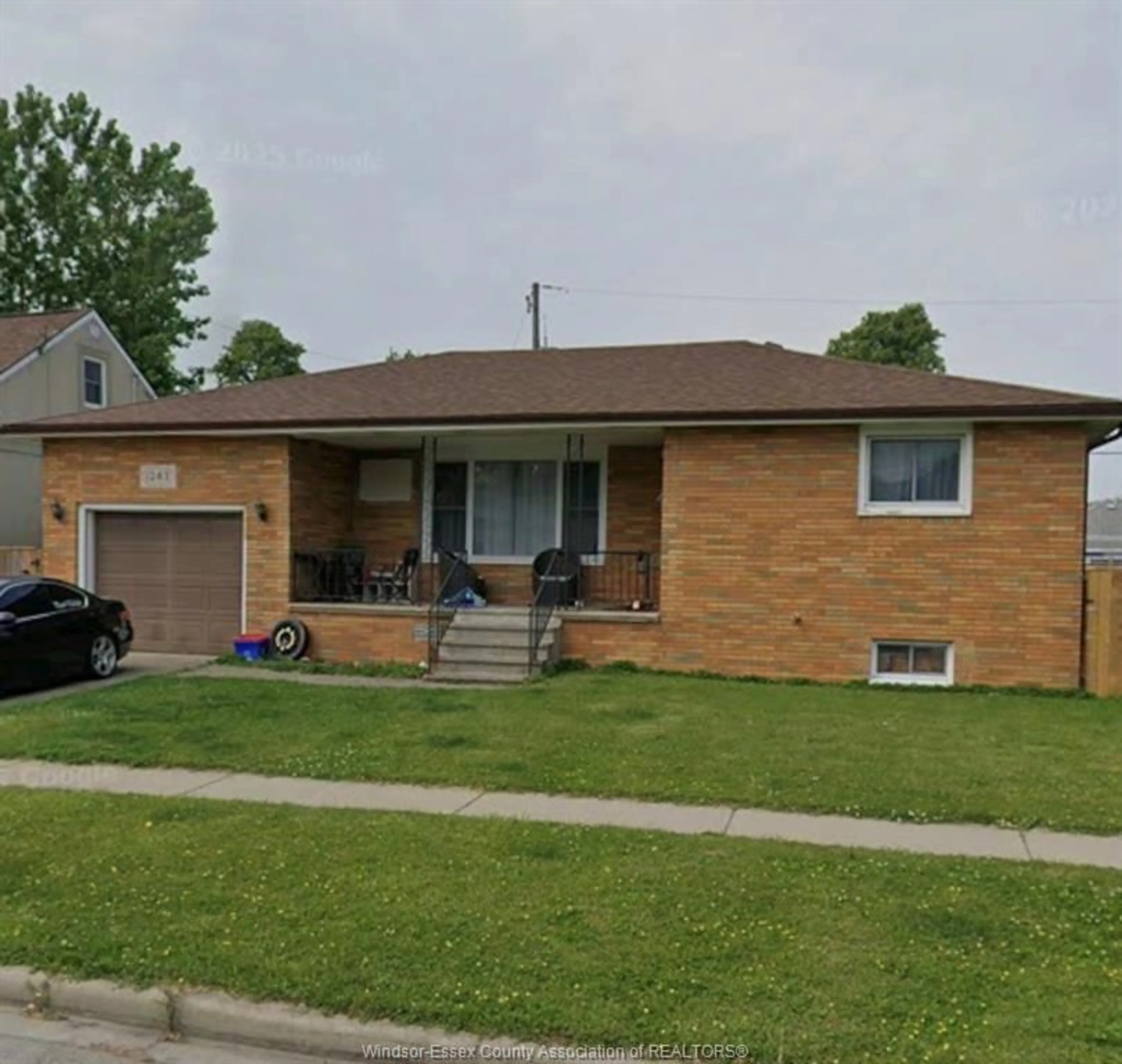 Home with brick exterior material, street for 1243 WESTCOTT Rd, Windsor Ontario N8Y 4B9