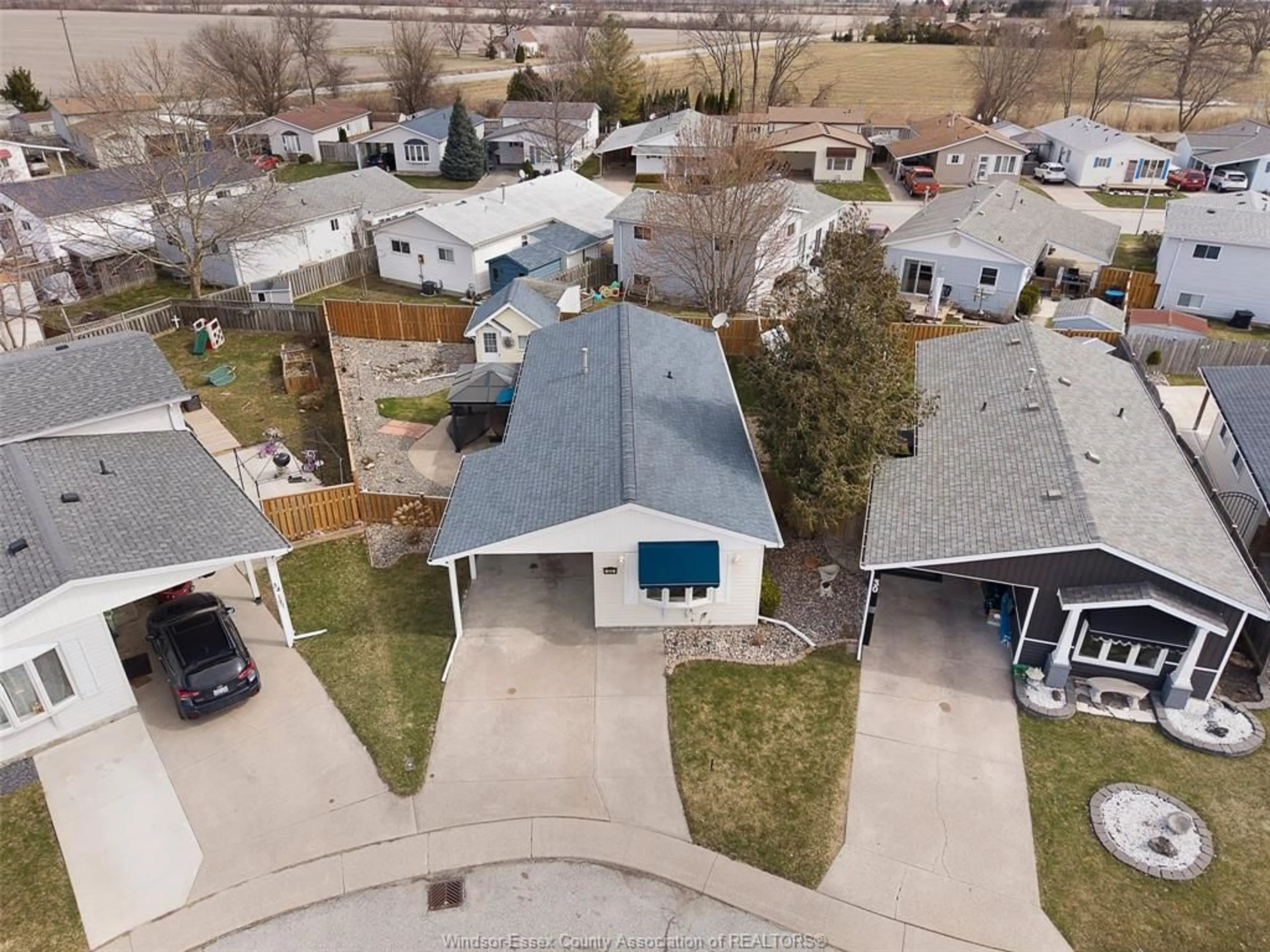A pic from outside/outdoor area/front of a property/back of a property/a pic from drone, street for 32 Chestnut, McGregor Ontario N0R 1J0