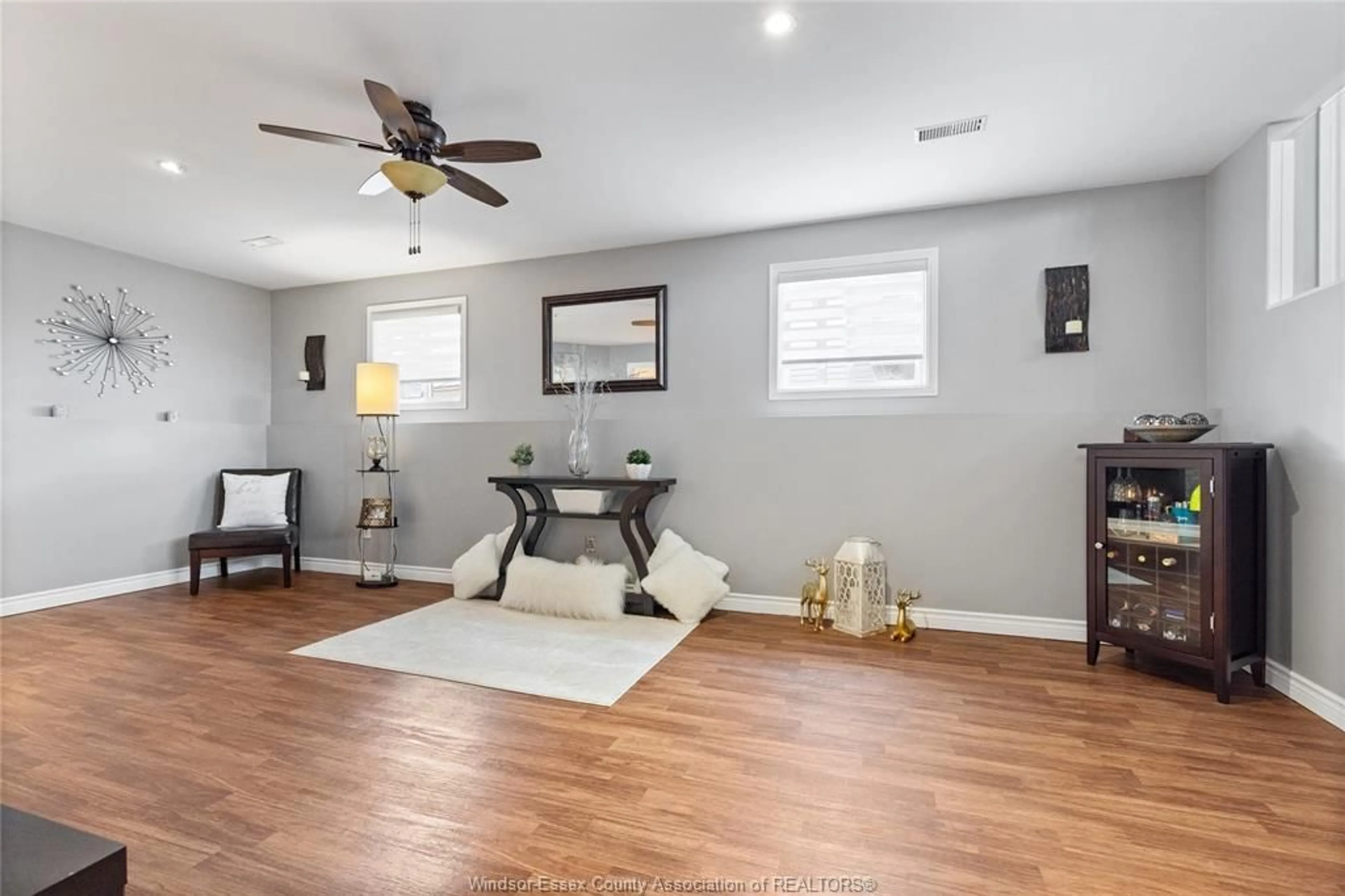 Living room with furniture, wood/laminate floor for 78 BRUSH Cres, Amherstburg Ontario N9V 3Y5