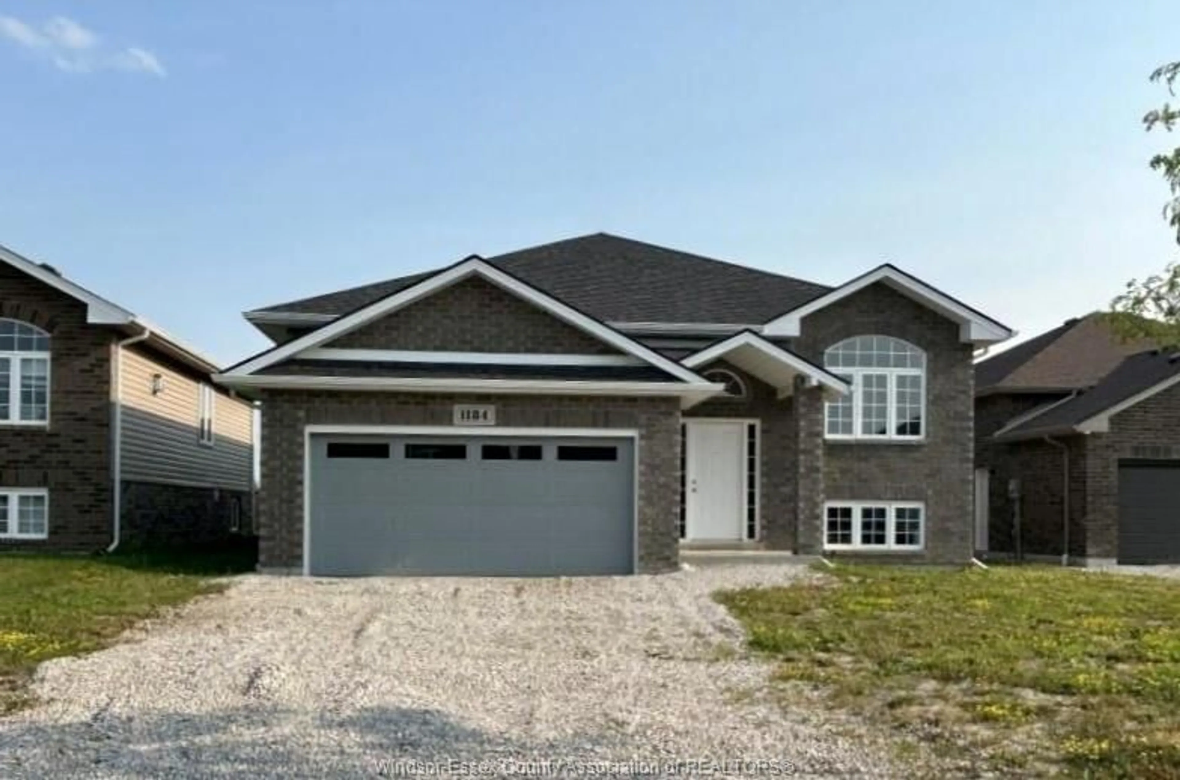 Home with brick exterior material, street for 1184 ASPEN RIDGE Cres, Lakeshore Ontario N8L 0W3