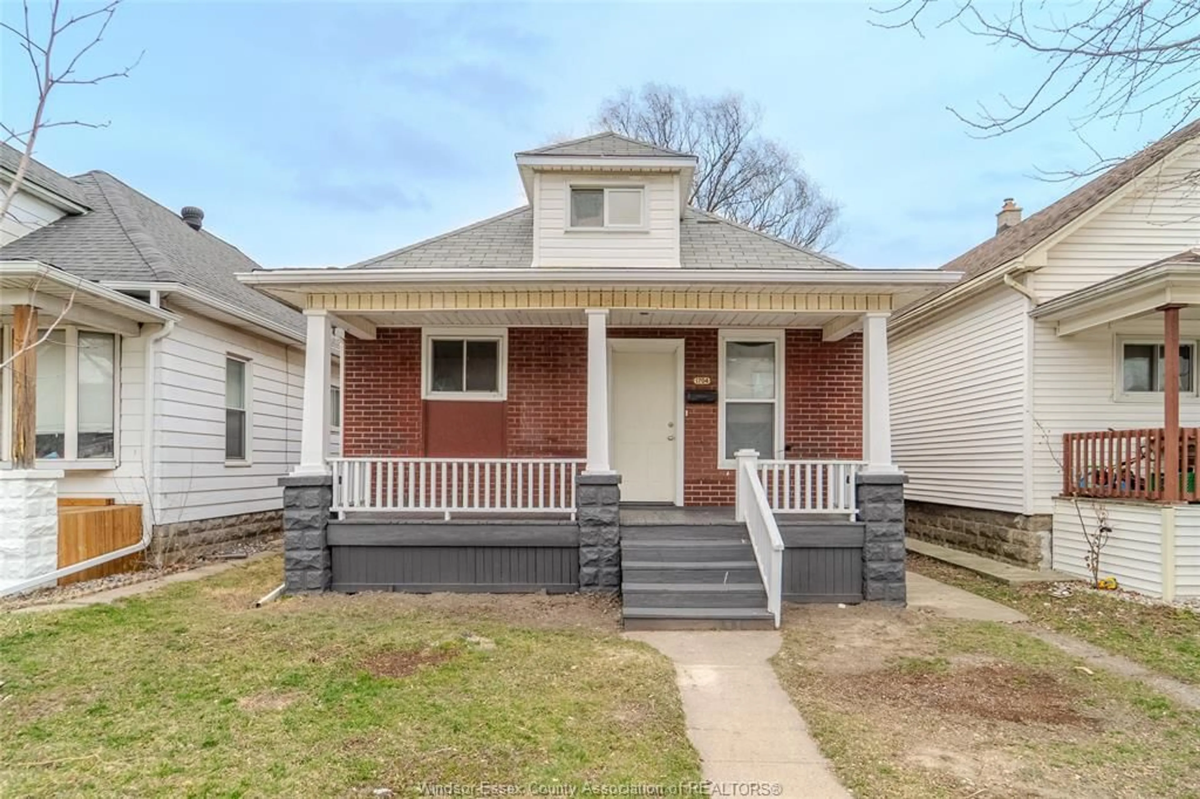 Home with brick exterior material, street for 1704 Highland Avenue, Windsor Ontario N8X 3S1