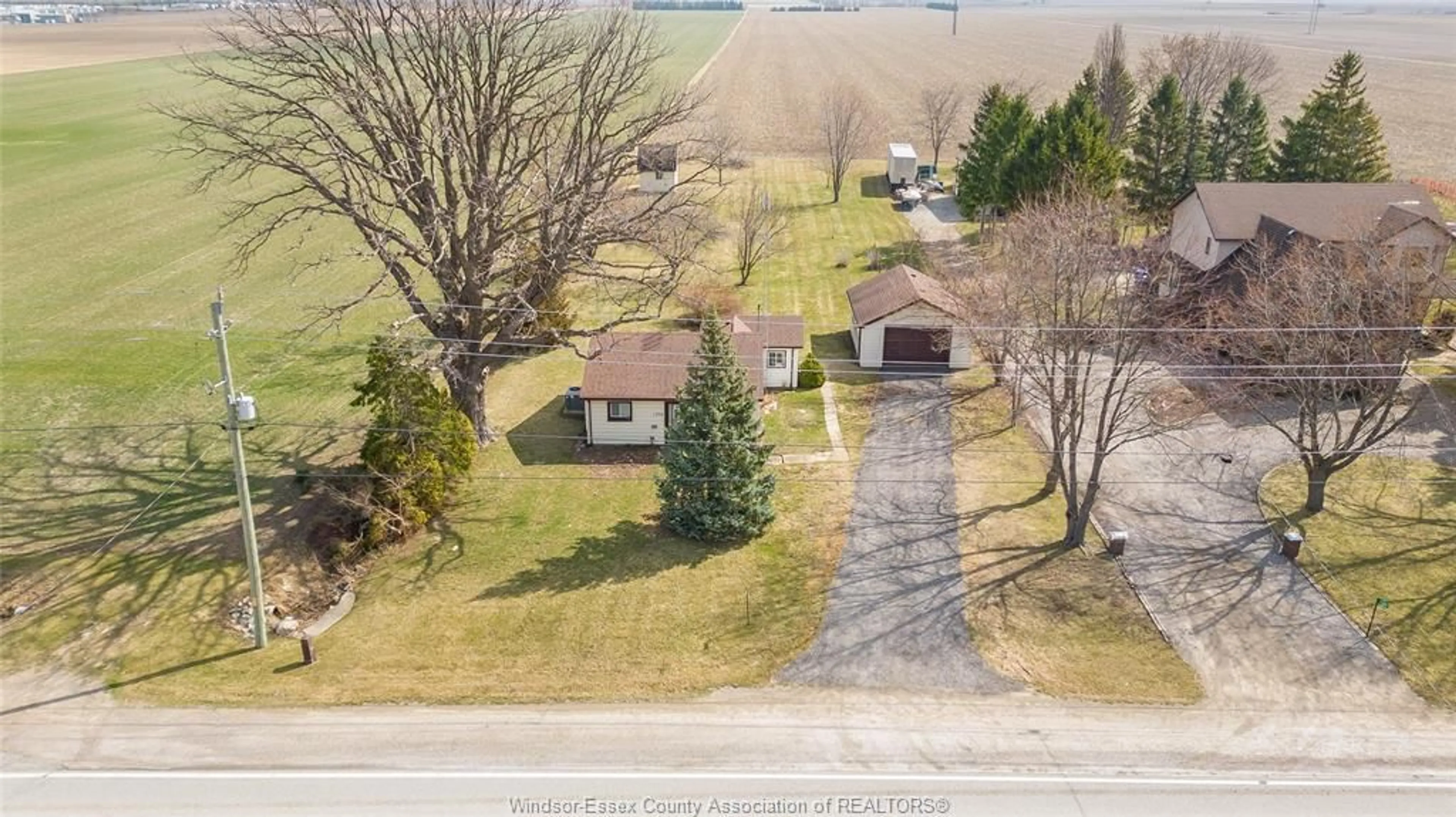 A pic from outside/outdoor area/front of a property/back of a property/a pic from drone, street for 1294 COUNTY RD 27, Lakeshore Ontario N8L 1B7