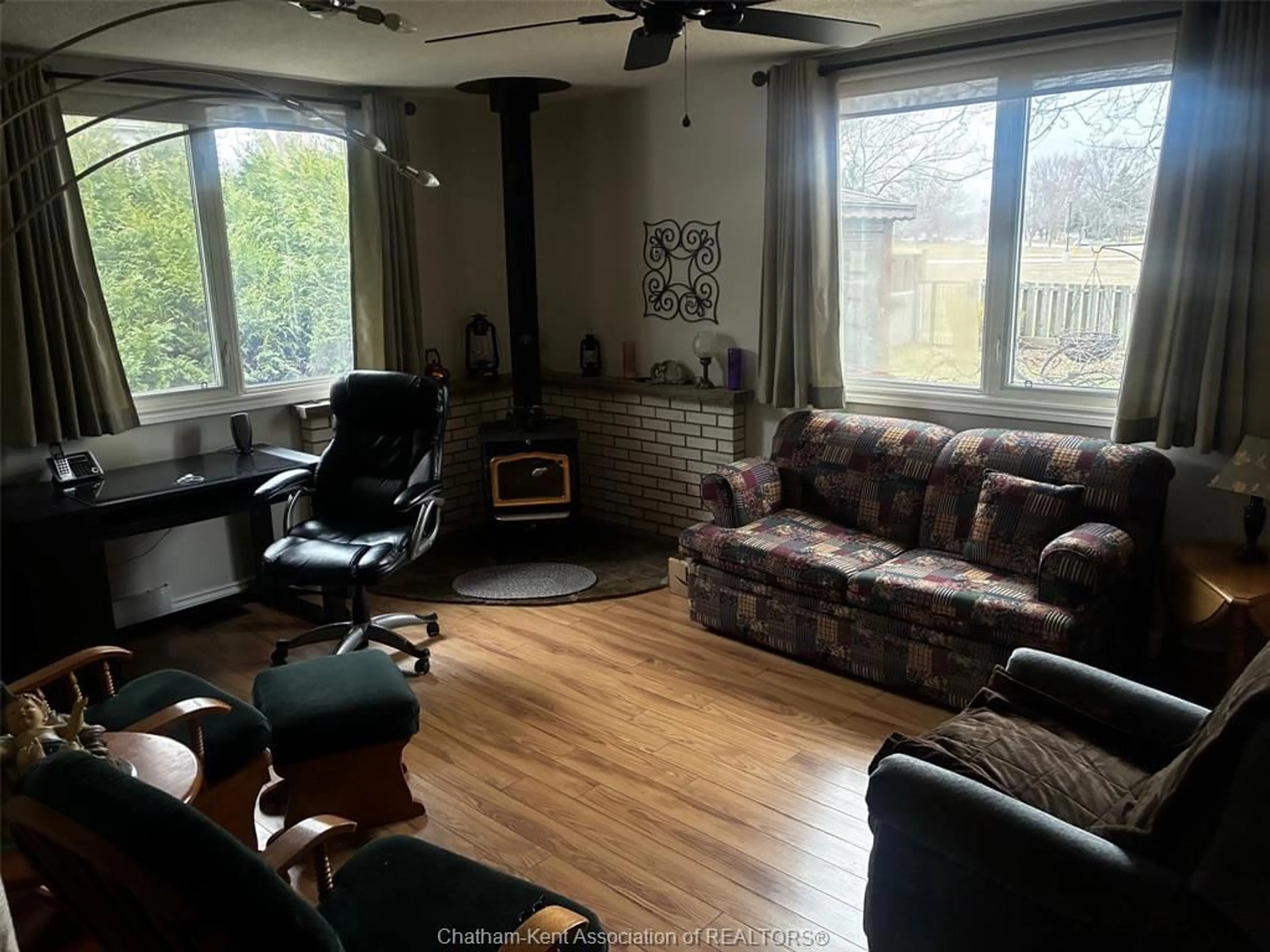 Living room with furniture, wood/laminate floor for 43 Highland Dr, Wallaceburg Ontario N8A 2K4