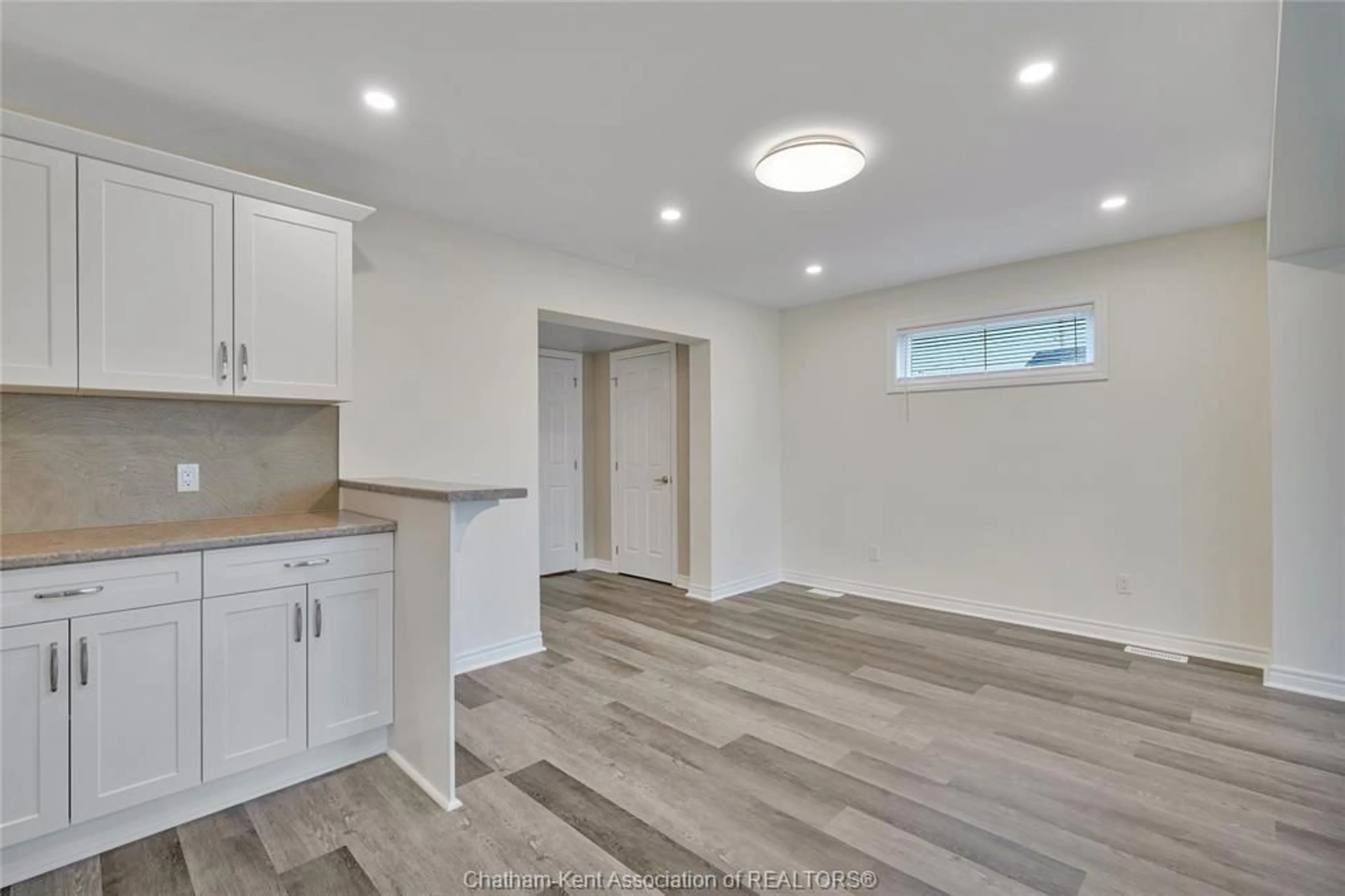 Open concept kitchen, wood/laminate floor for 248 PARK Ave, Chatham Ontario N7M 3V9