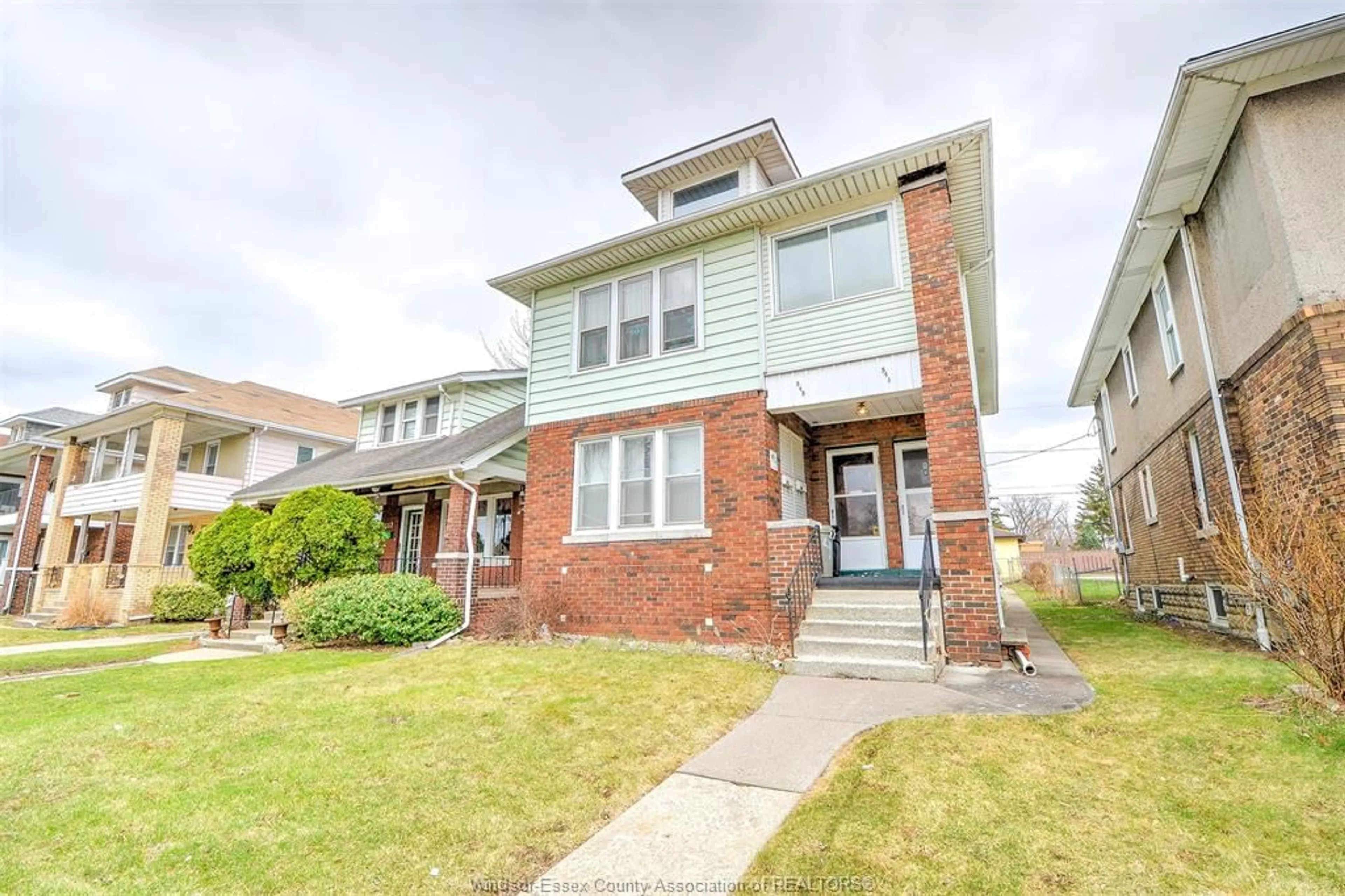 Home with brick exterior material, street for 543-545 GILES Blvd, Windsor Ontario N9A 4E1