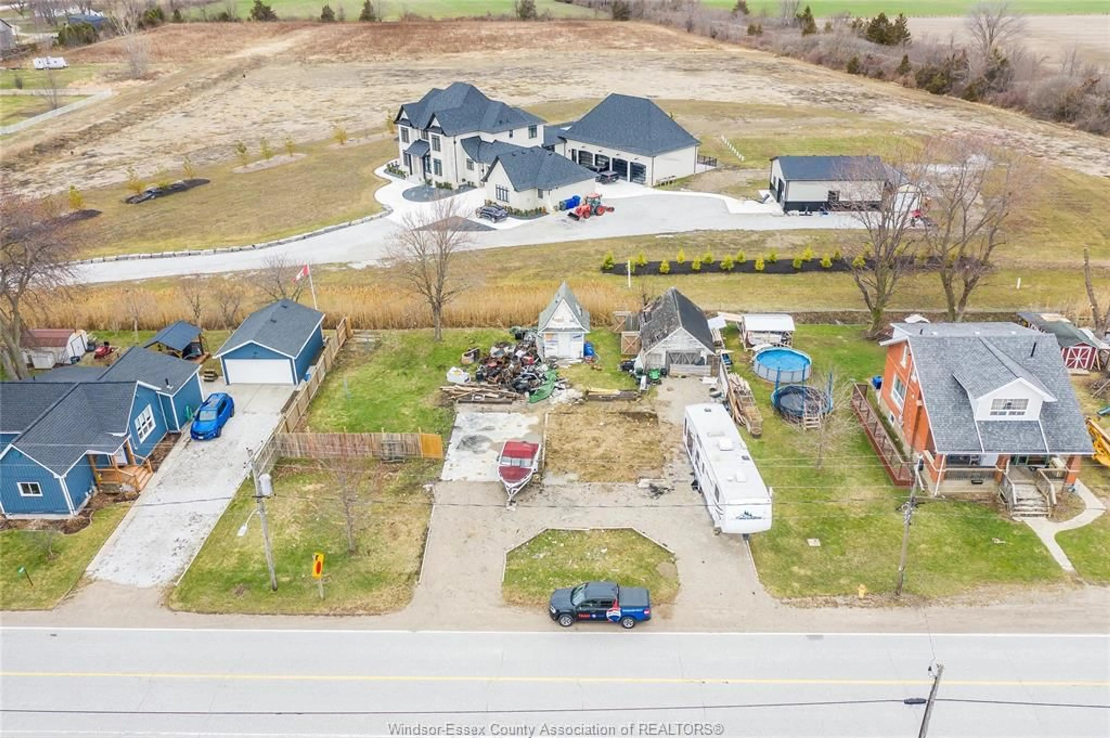 A pic from outside/outdoor area/front of a property/back of a property/a pic from drone, street for 2265 COUNTY RD 31, Lakeshore Ontario N0R 1R0