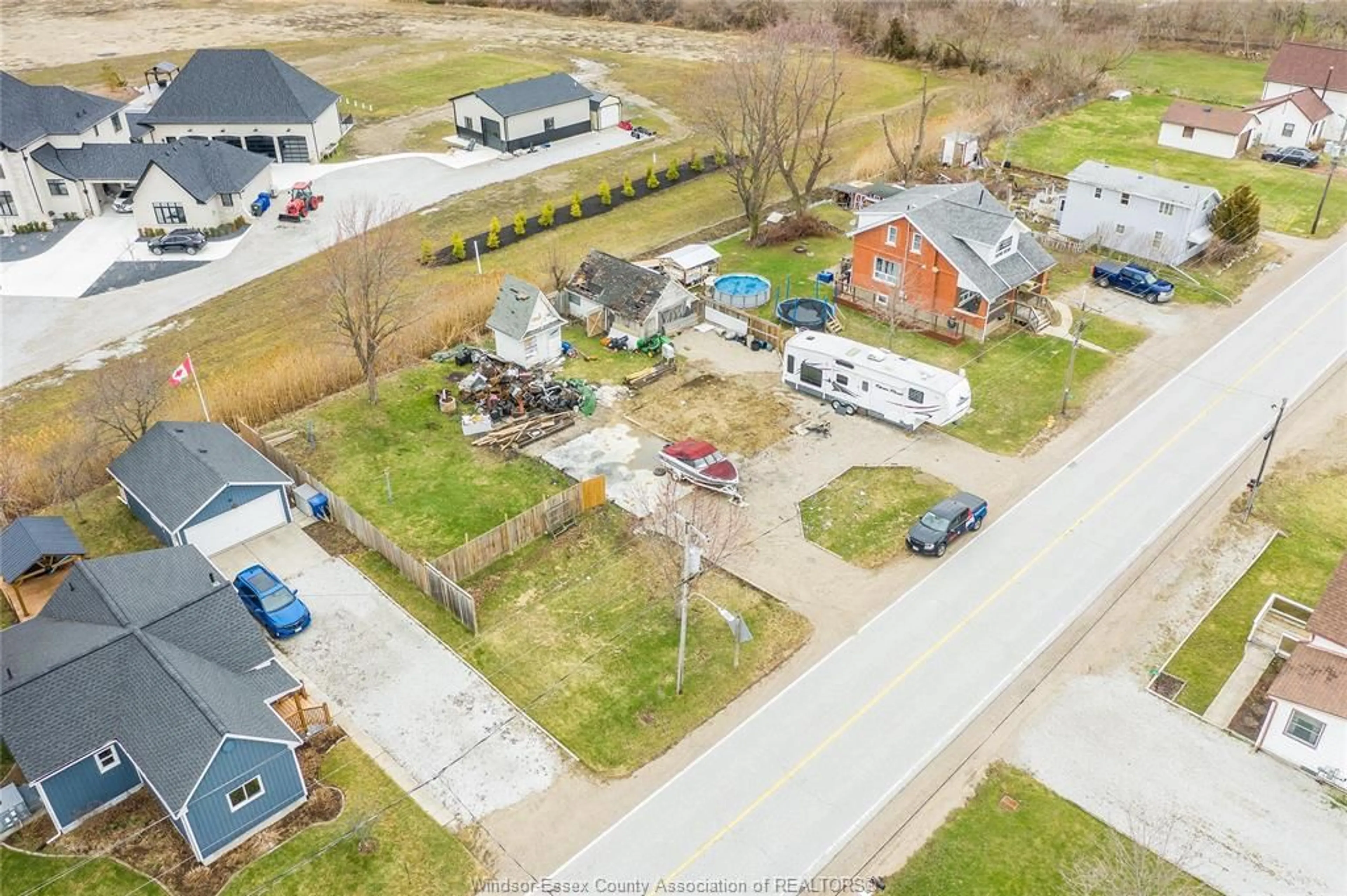 A pic from outside/outdoor area/front of a property/back of a property/a pic from drone, street for 2265 COUNTY RD 31, Lakeshore Ontario N0R 1R0