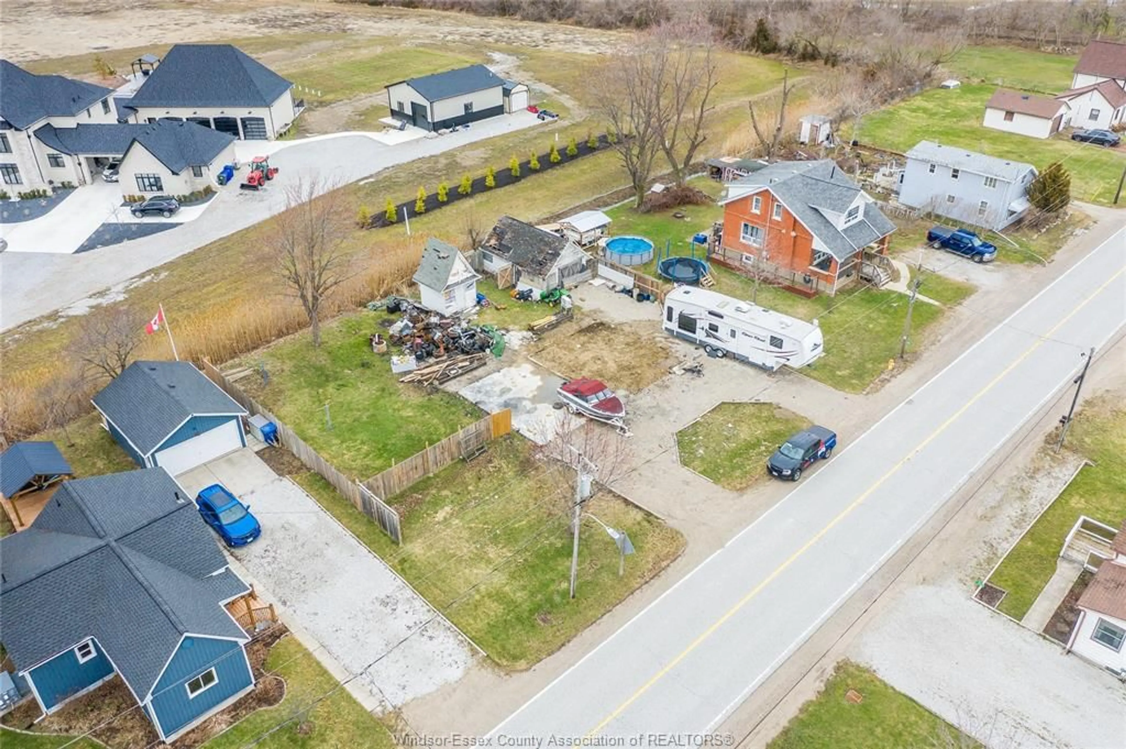 A pic from outside/outdoor area/front of a property/back of a property/a pic from drone, street for 2265 COUNTY RD 31, Lakeshore Ontario N0R 1R0