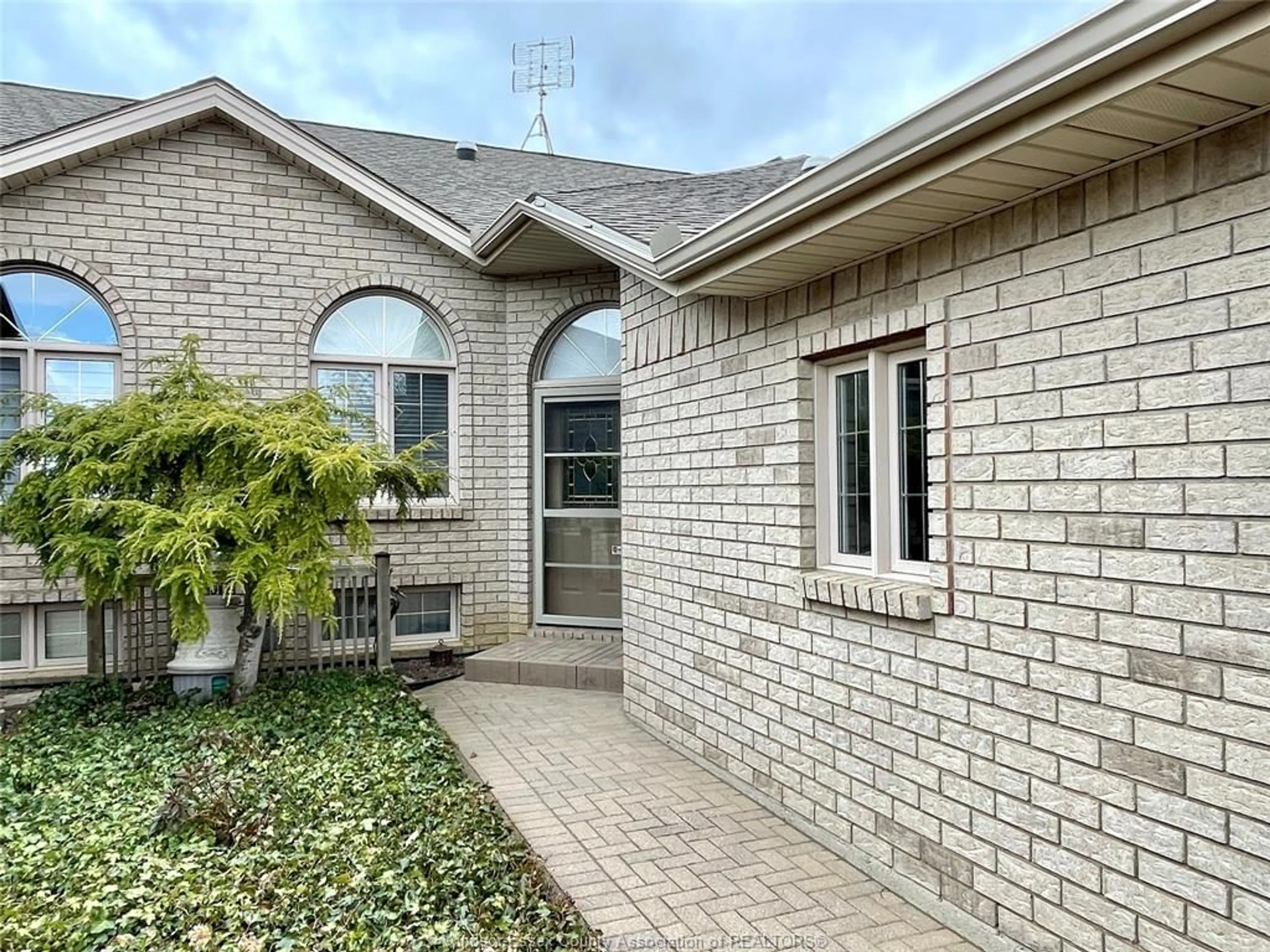 Home with brick exterior material, street for 56 Queen's Hill Cres, Leamington Ontario N8H 5M5