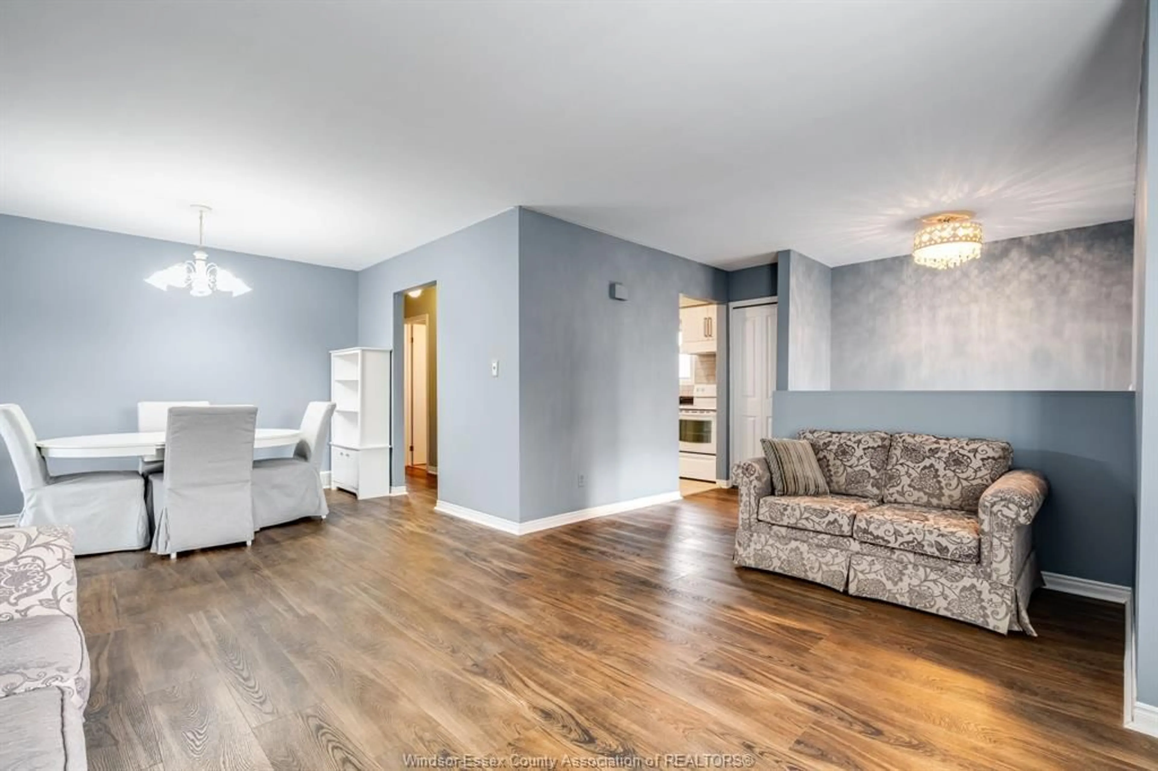 Living room with furniture, wood/laminate floor for 1164 Brookview, Windsor Ontario N8W 5H5