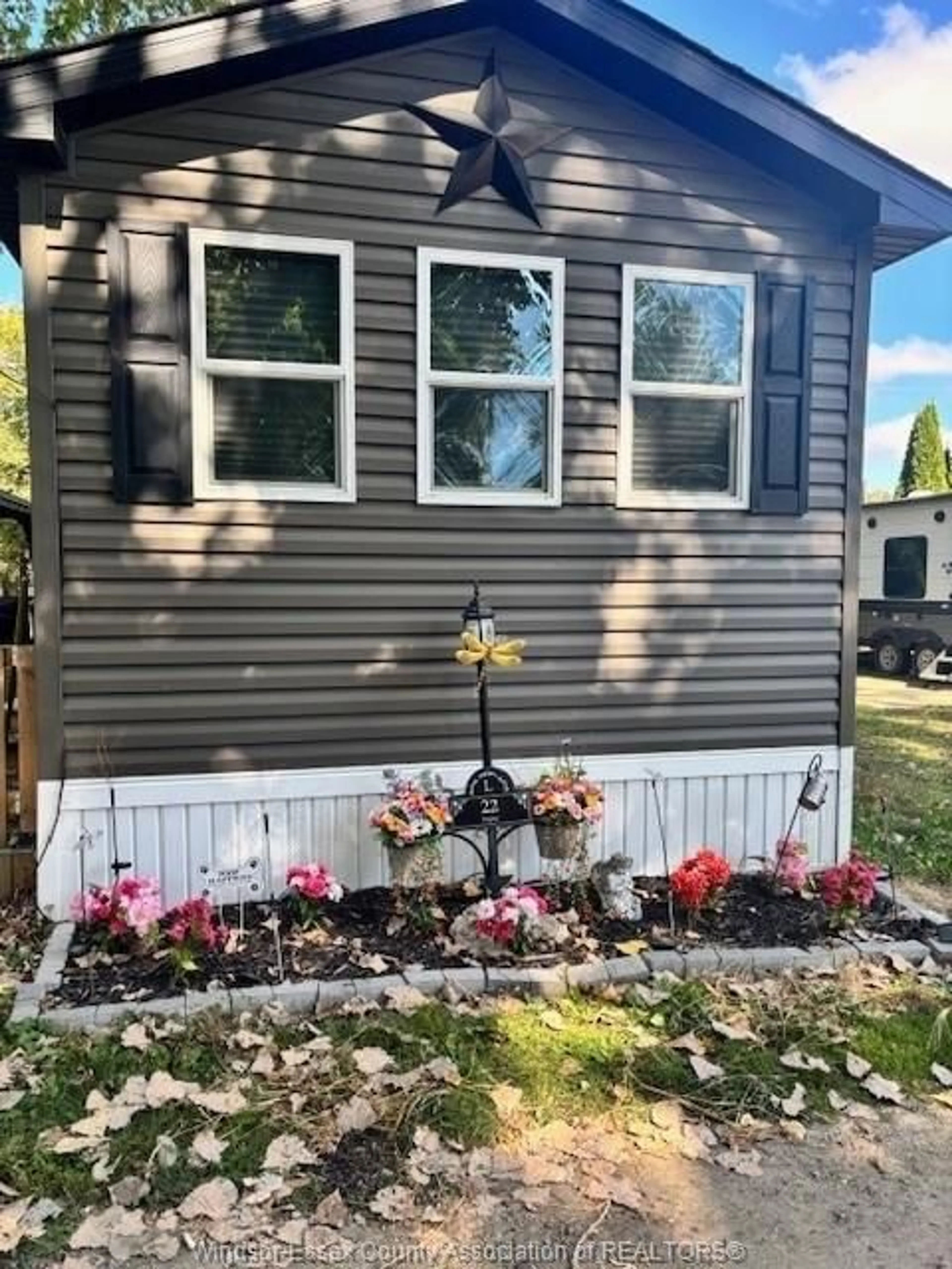 Home with vinyl exterior material, street for 22 POPLAR Lane, Leamington Ontario N0P 2G0