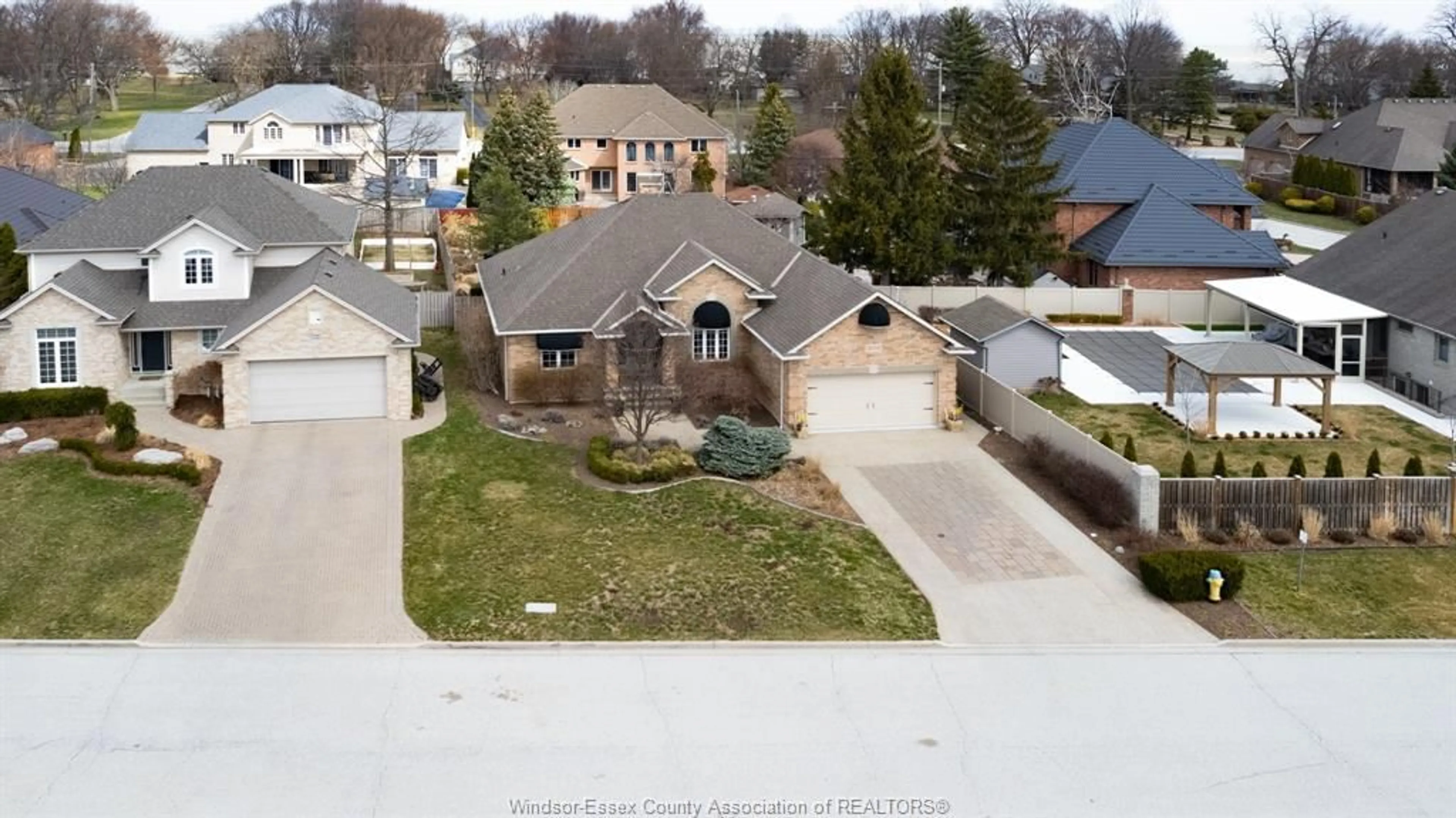A pic from outside/outdoor area/front of a property/back of a property/a pic from drone, street for 606 GEORGE KENNEDY Way, Lakeshore Ontario N8L 0Z9