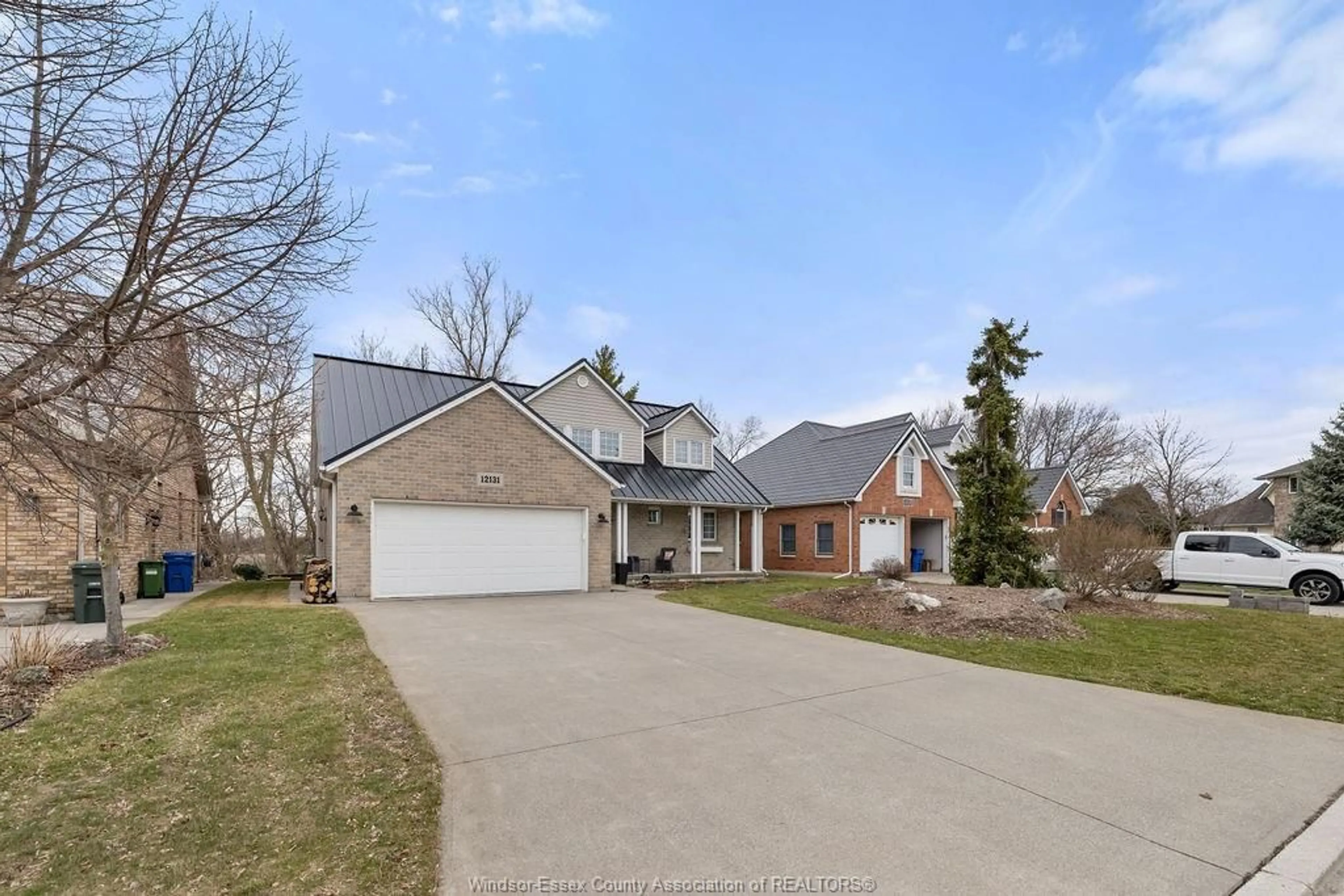 A pic from outside/outdoor area/front of a property/back of a property/a pic from drone, street for 12131 EMMA MARIA, Tecumseh Ontario N8N 2M1