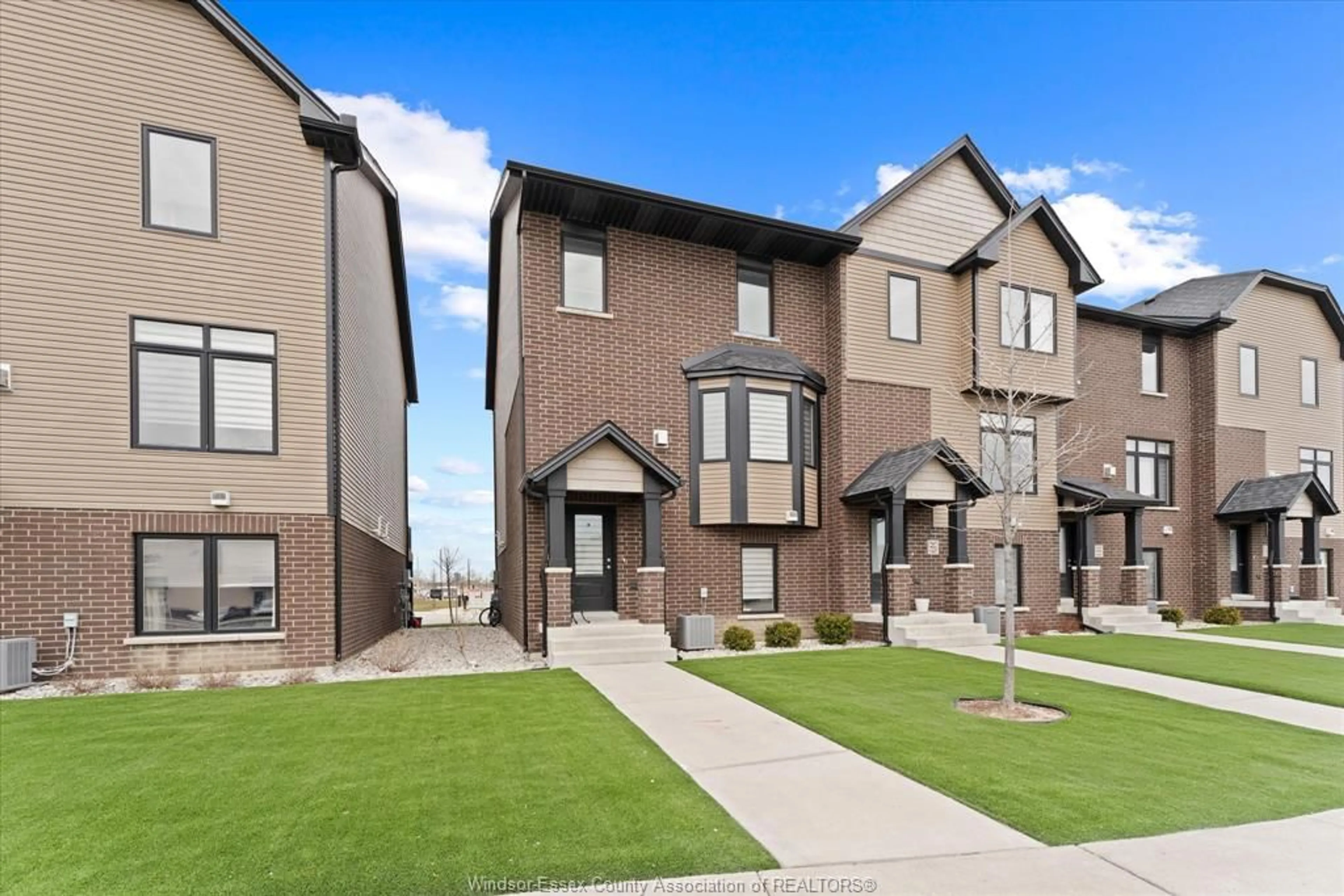 Home with brick exterior material, street for 723 BROWNSTONE Rd, Lakeshore Ontario N9K 0A8