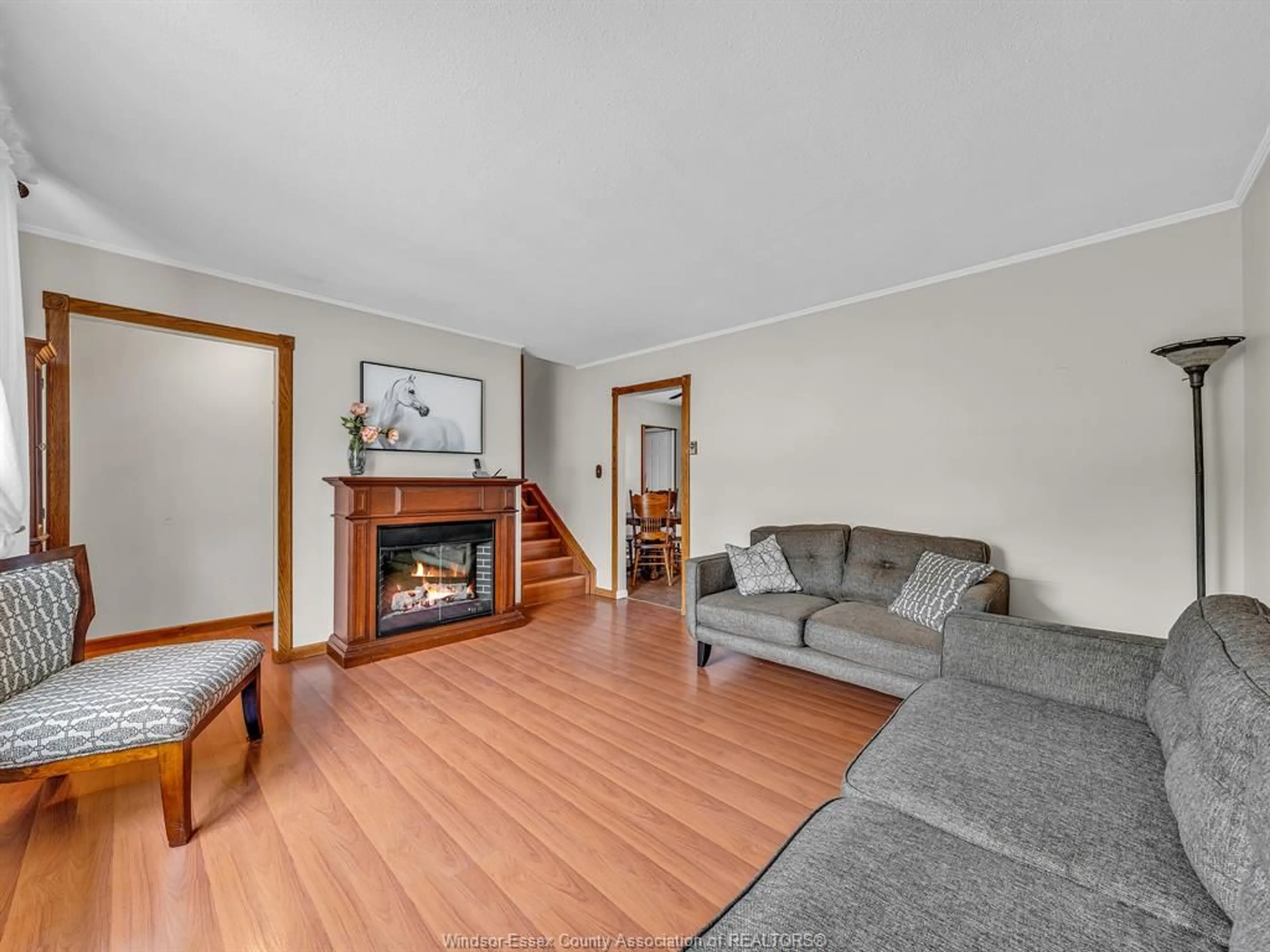 Living room with furniture, wood/laminate floor for 184 Harold Cull Dr, Kingsville Ontario N9Y 3G1