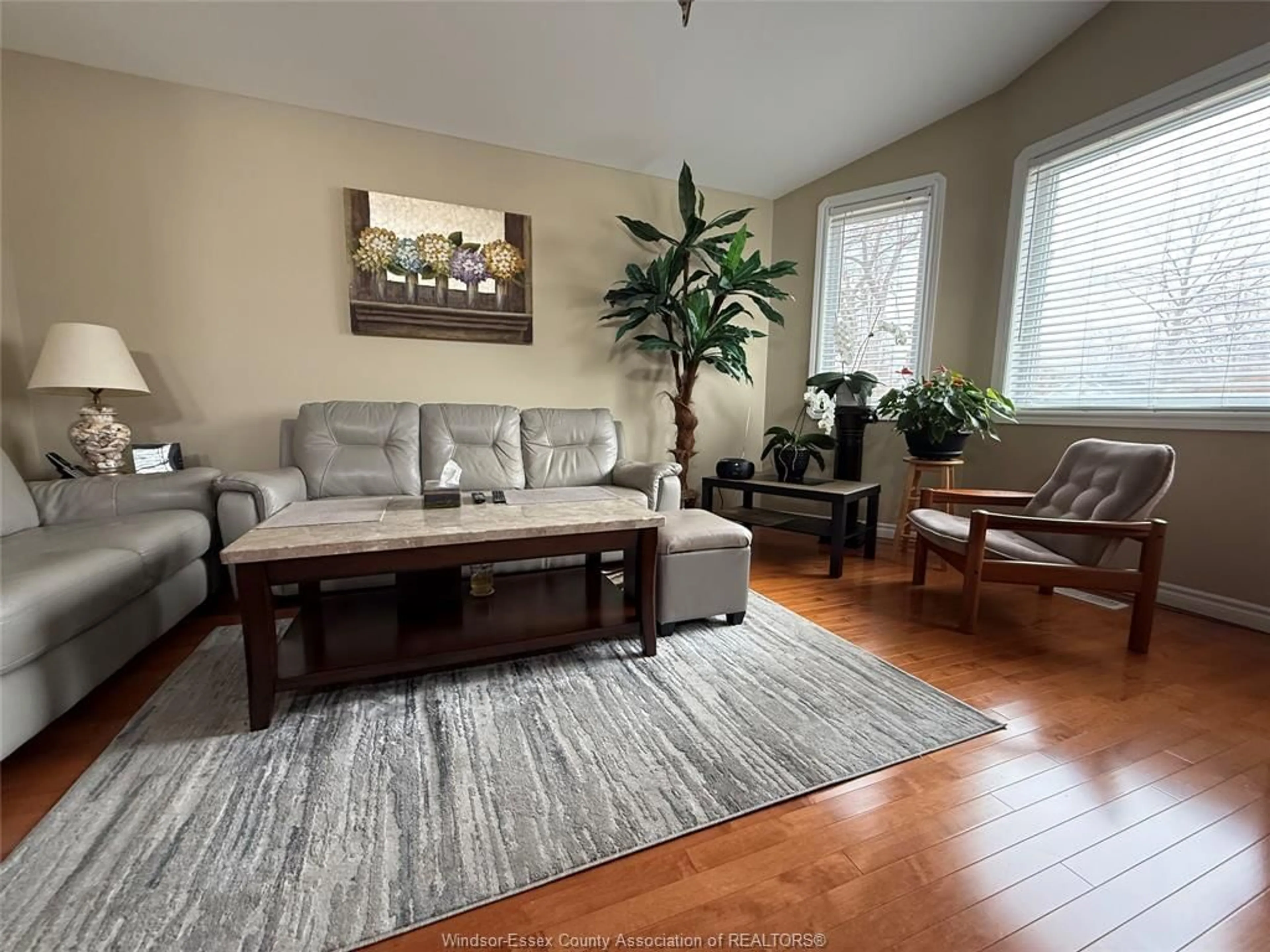 Living room with furniture, wood/laminate floor for 551 CLOVER St, Windsor Ontario N8P 1C5