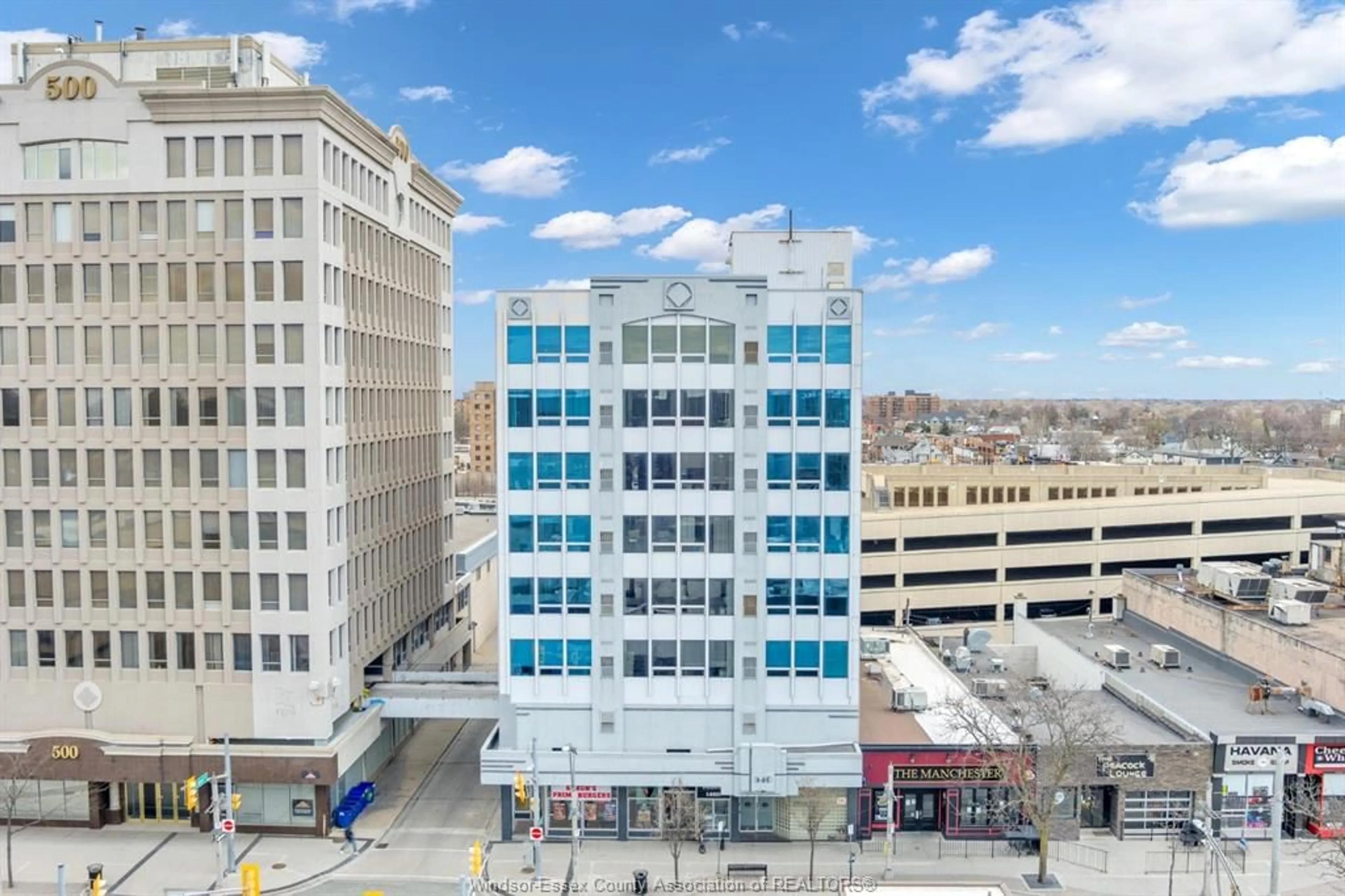 A pic from outside/outdoor area/front of a property/back of a property/a pic from drone, building for 540 OUELLETTE Ave #5D, Windsor Ontario N9A 1B7