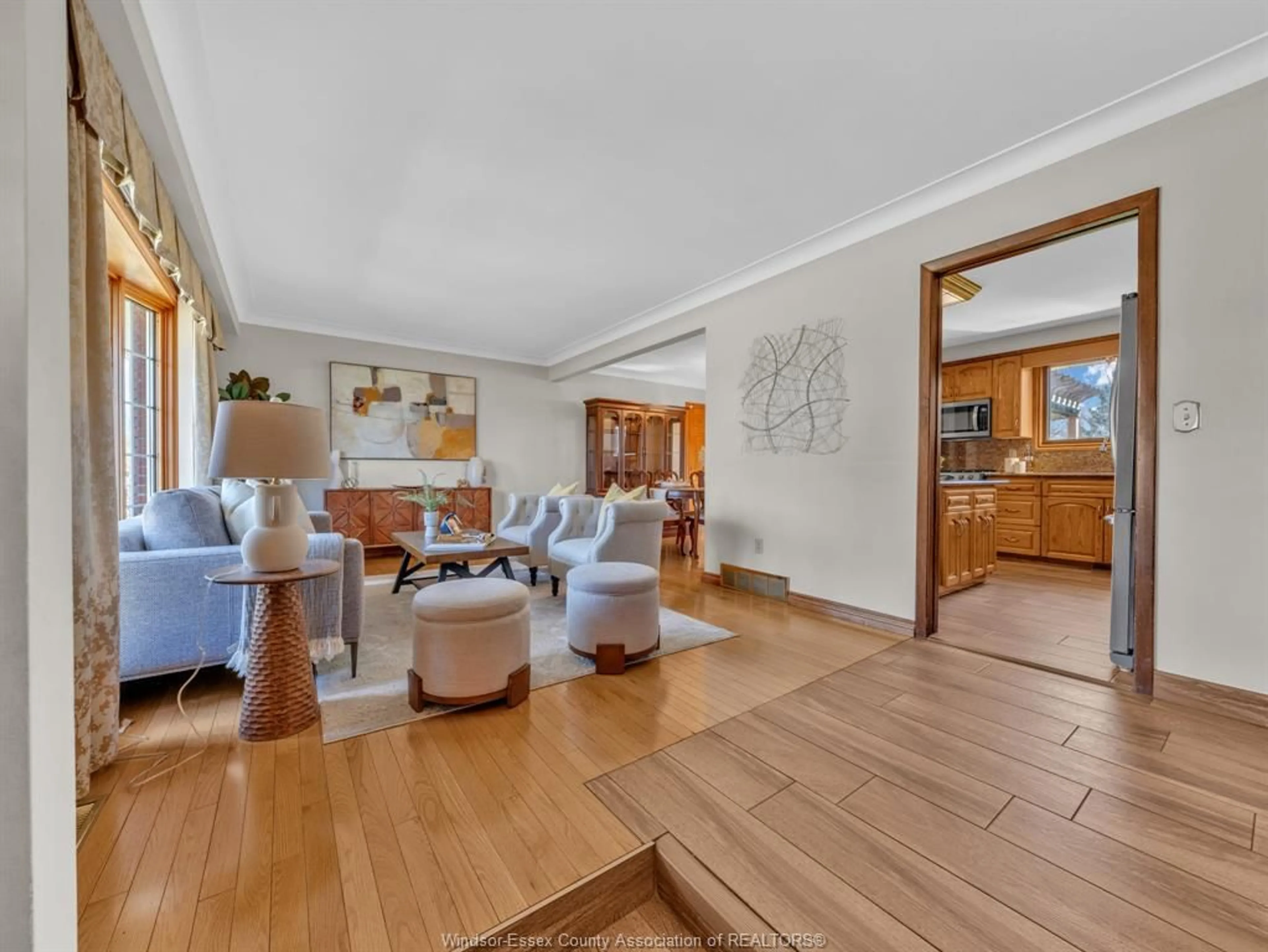 Living room with furniture, wood/laminate floor for 2725 BOUFFARD Rd, LaSalle Ontario N9H 1W3