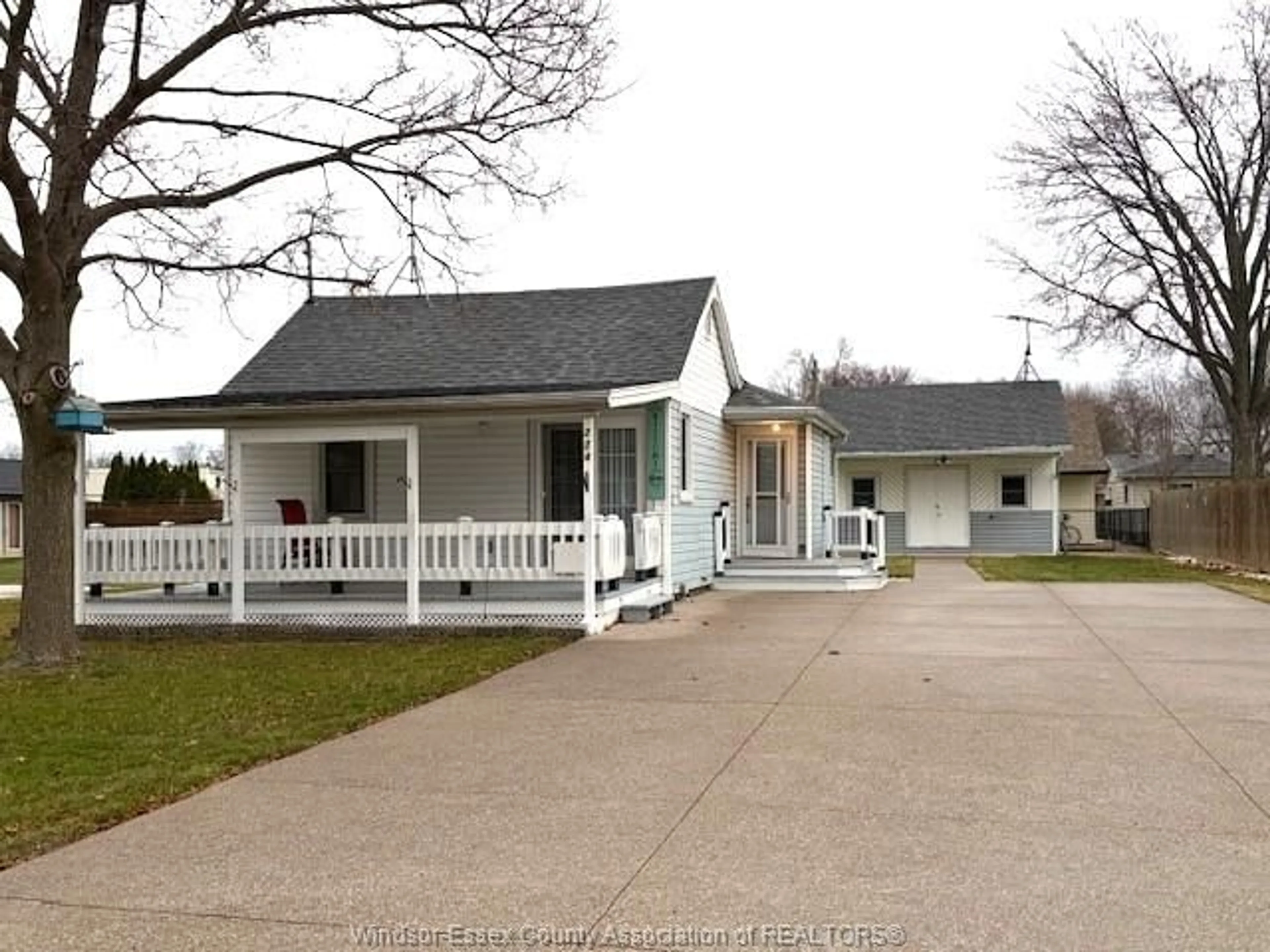 Home with vinyl exterior material, street for 214 Caruhel Dr., Lakeshore Ontario N0R 1C0