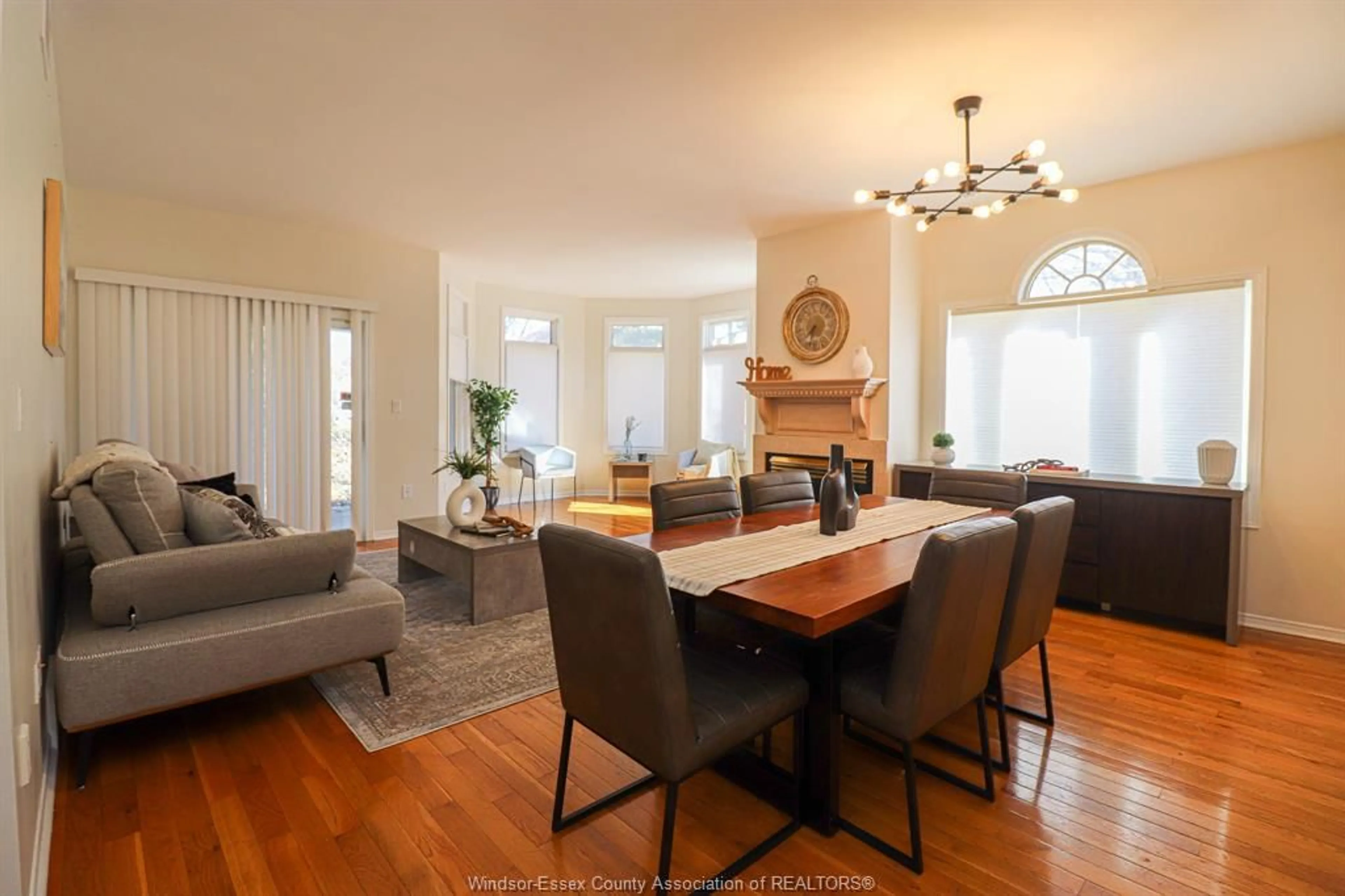 Living room with furniture, wood/laminate floor for 4612 ASCOT Crt, Windsor Ontario N9G 2M1