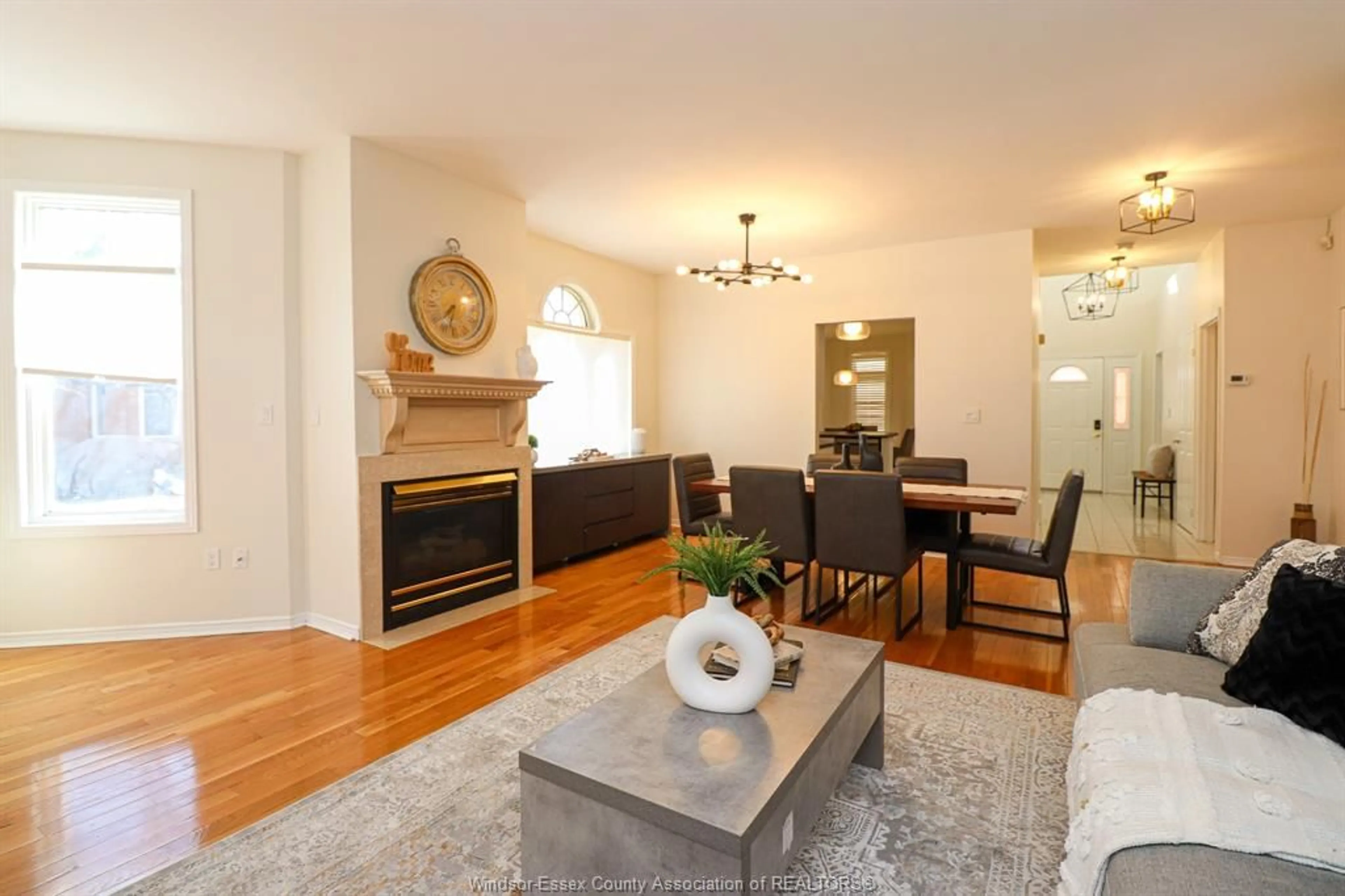 Living room with furniture, wood/laminate floor for 4612 ASCOT Crt, Windsor Ontario N9G 2M1