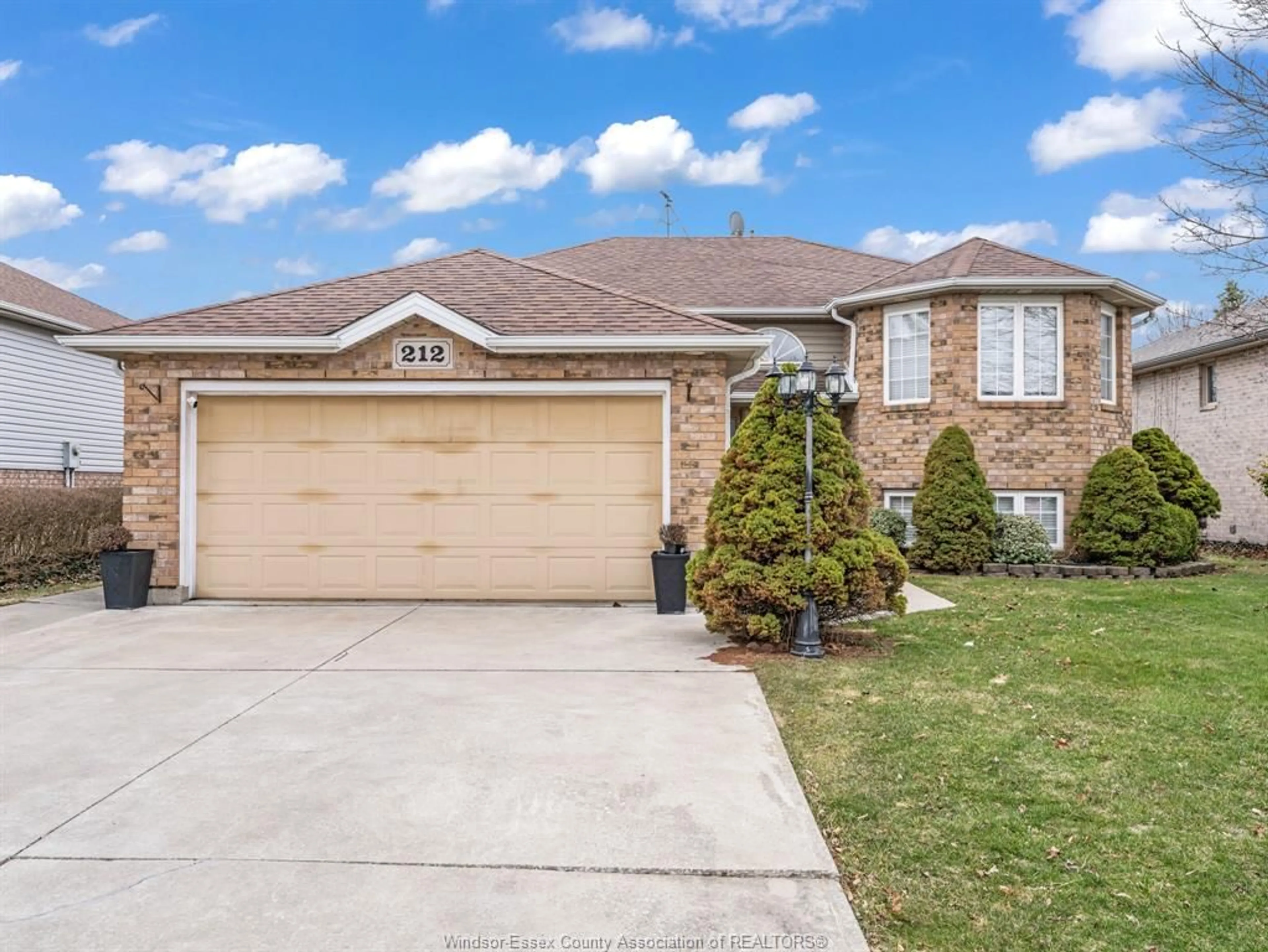 Home with brick exterior material, street for 212 GRANDVIEW Blvd, Lakeshore Ontario N0R 1A0