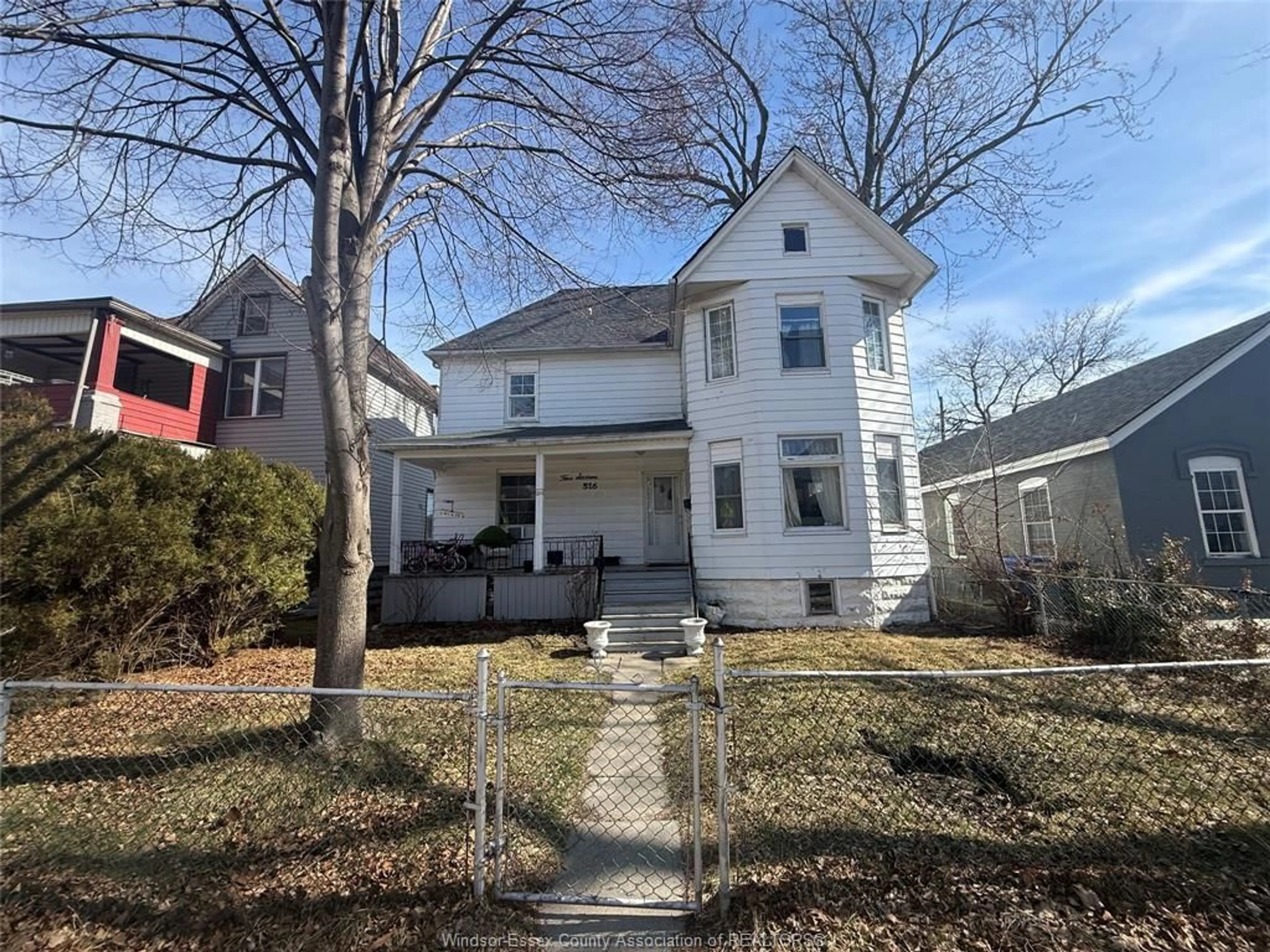 Home with vinyl exterior material, street for 516 DOUGALL Ave, Windsor Ontario N9A 4P6