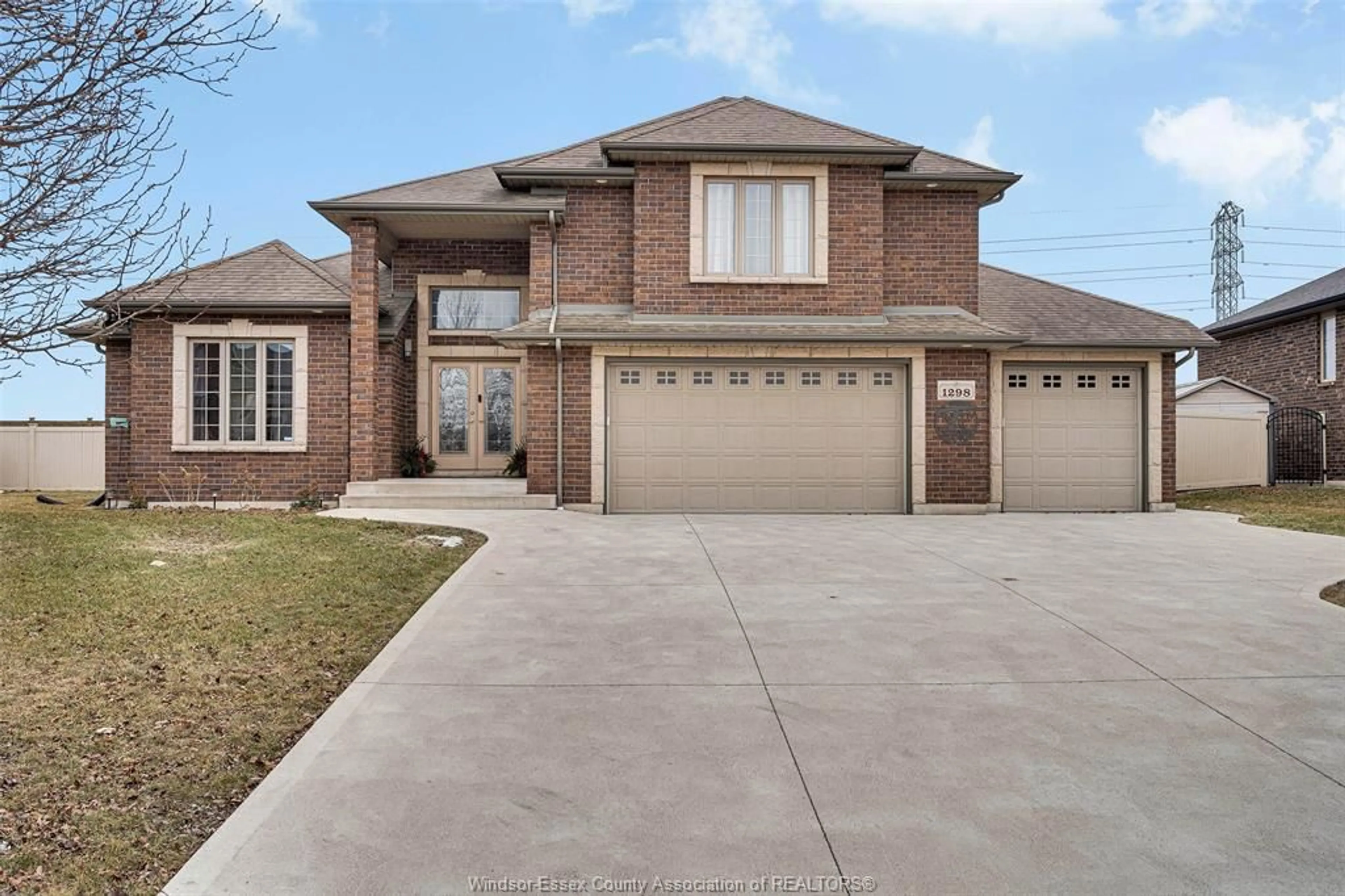 Home with brick exterior material, street for 1298 DEER RUN Trail, Lakeshore Ontario N8L 0S8