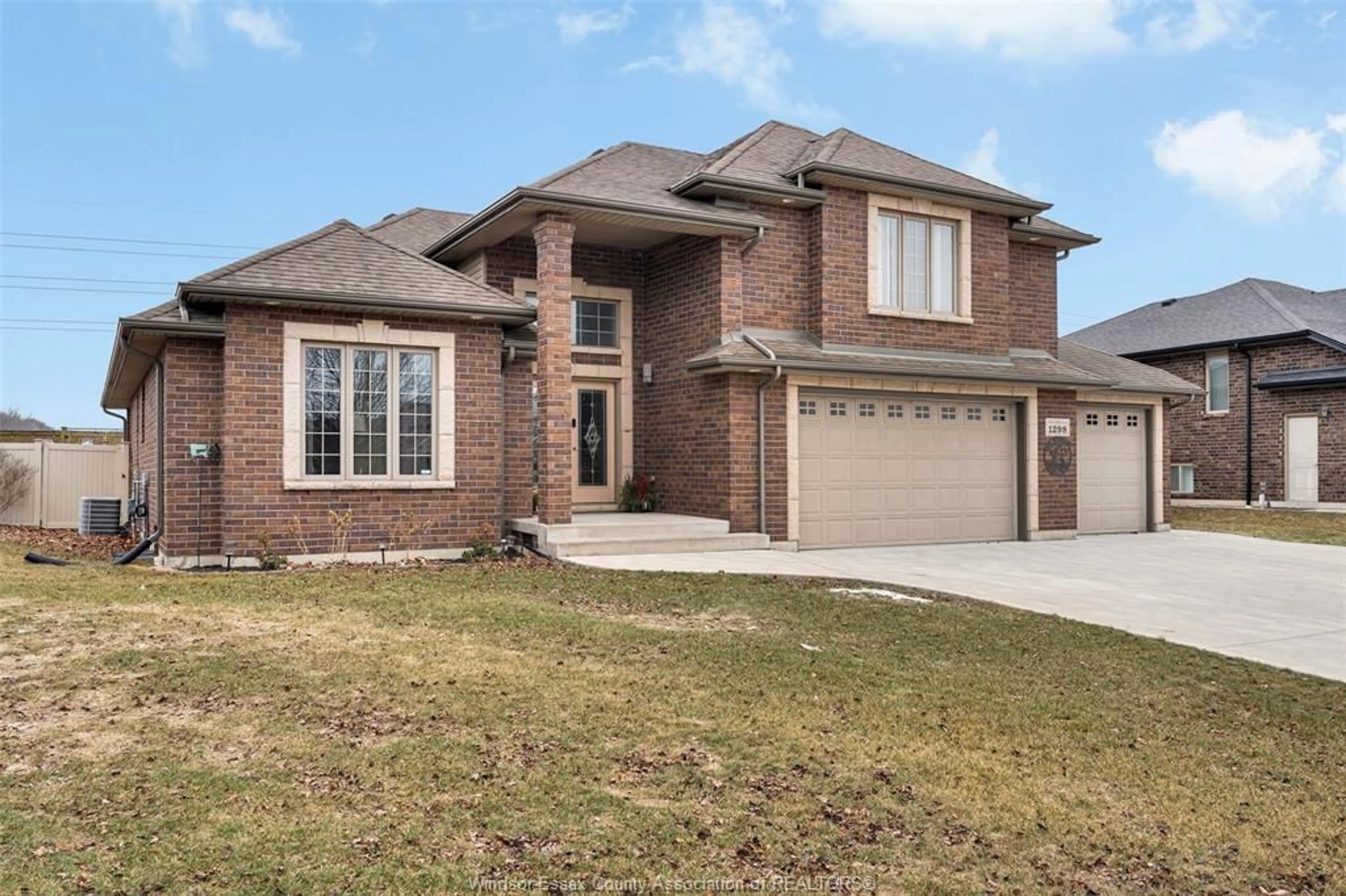 Home with brick exterior material, street for 1298 DEER RUN Trail, Lakeshore Ontario N8L 0S8