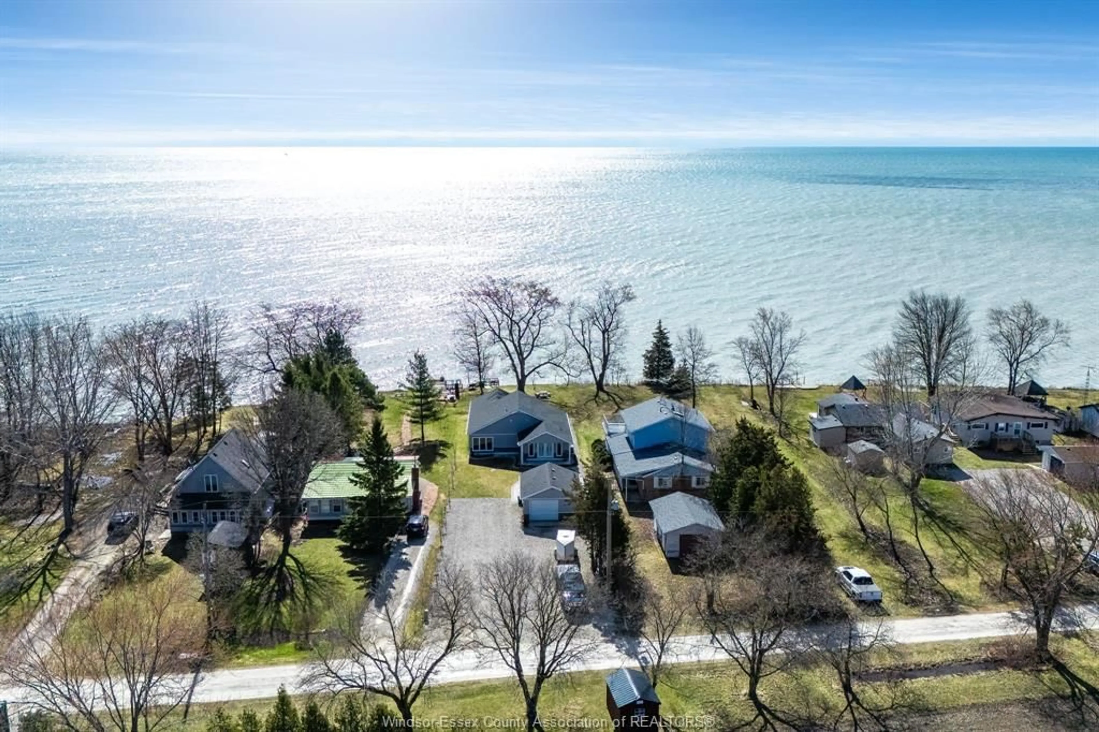 A pic from outside/outdoor area/front of a property/back of a property/a pic from drone, water/lake/river/ocean view for 952 Hiawatha Beach, Wheatley Ontario N0P 2P0