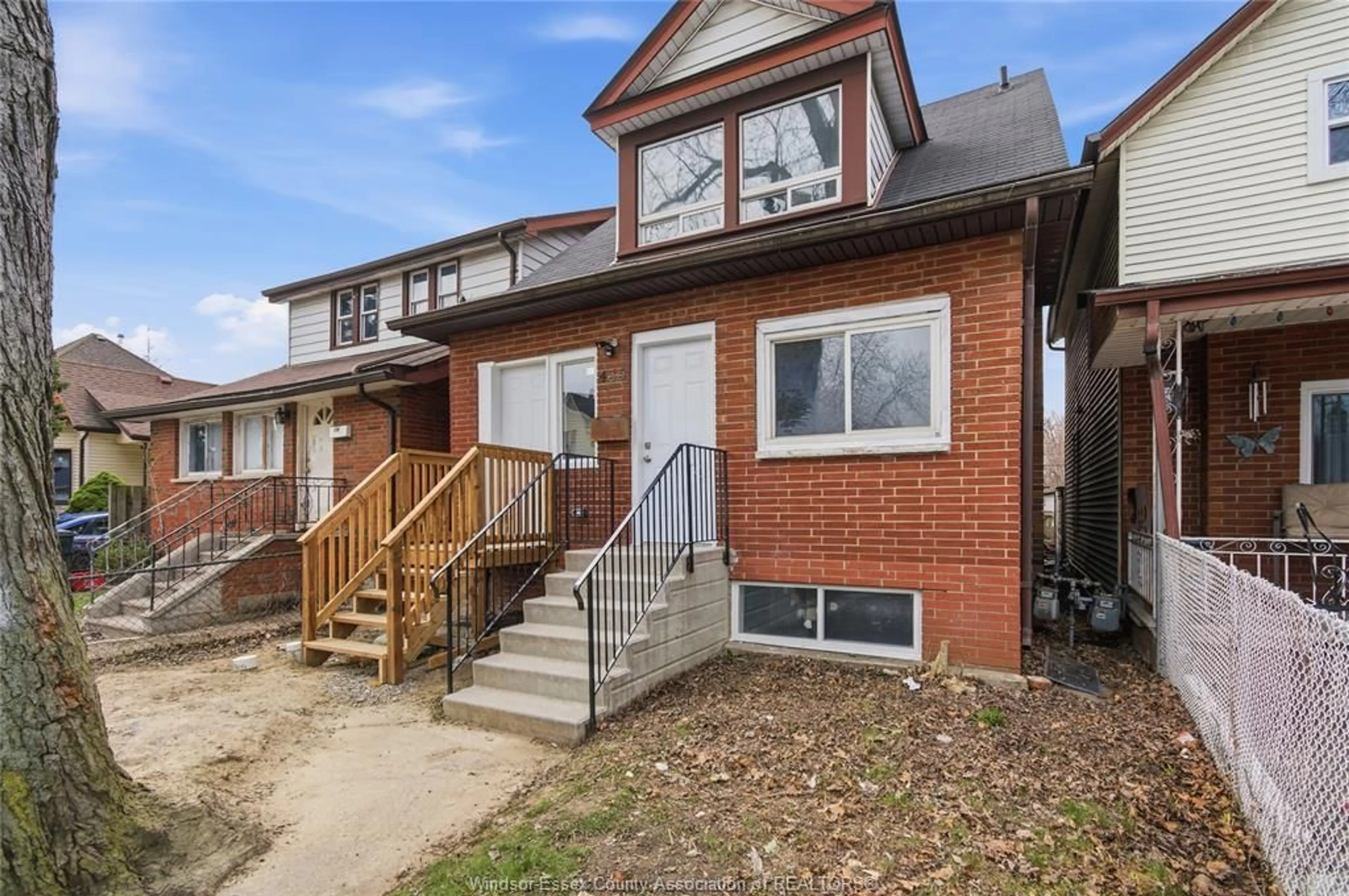 Home with brick exterior material, street for 435 CARON Ave, Windsor Ontario N8A 5B3
